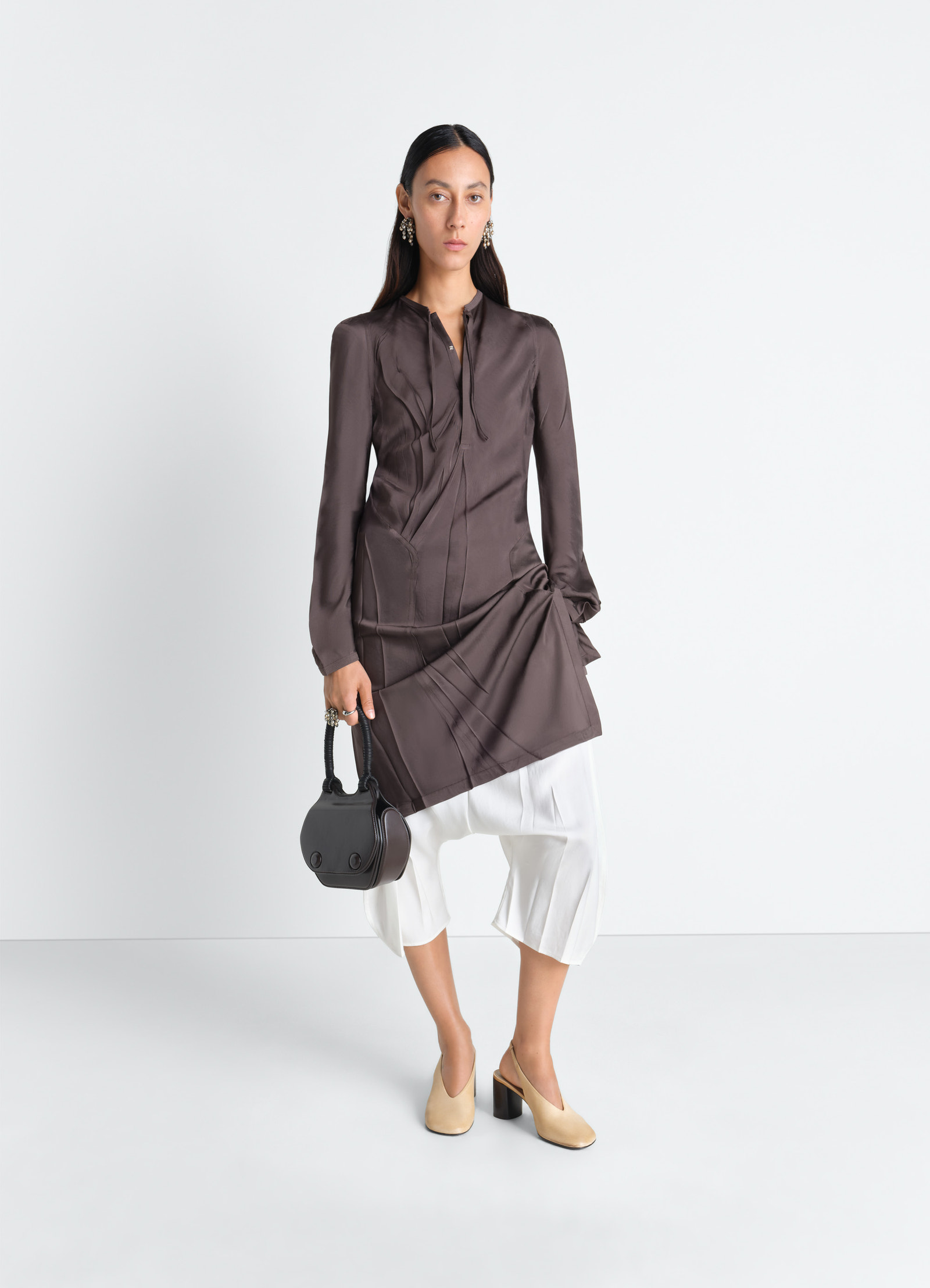 Creased bias dress in poly viscose twill, model shot, front view hip cut-outs, bias-cut skirt
