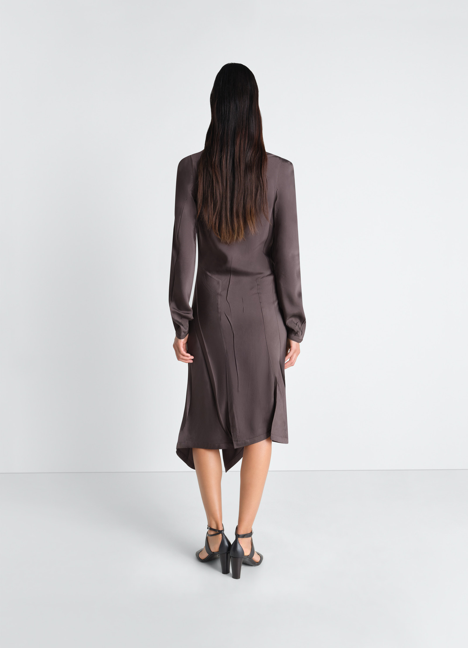 Creased bias dress in poly viscose twill, model shot, back view asymmetrical hem