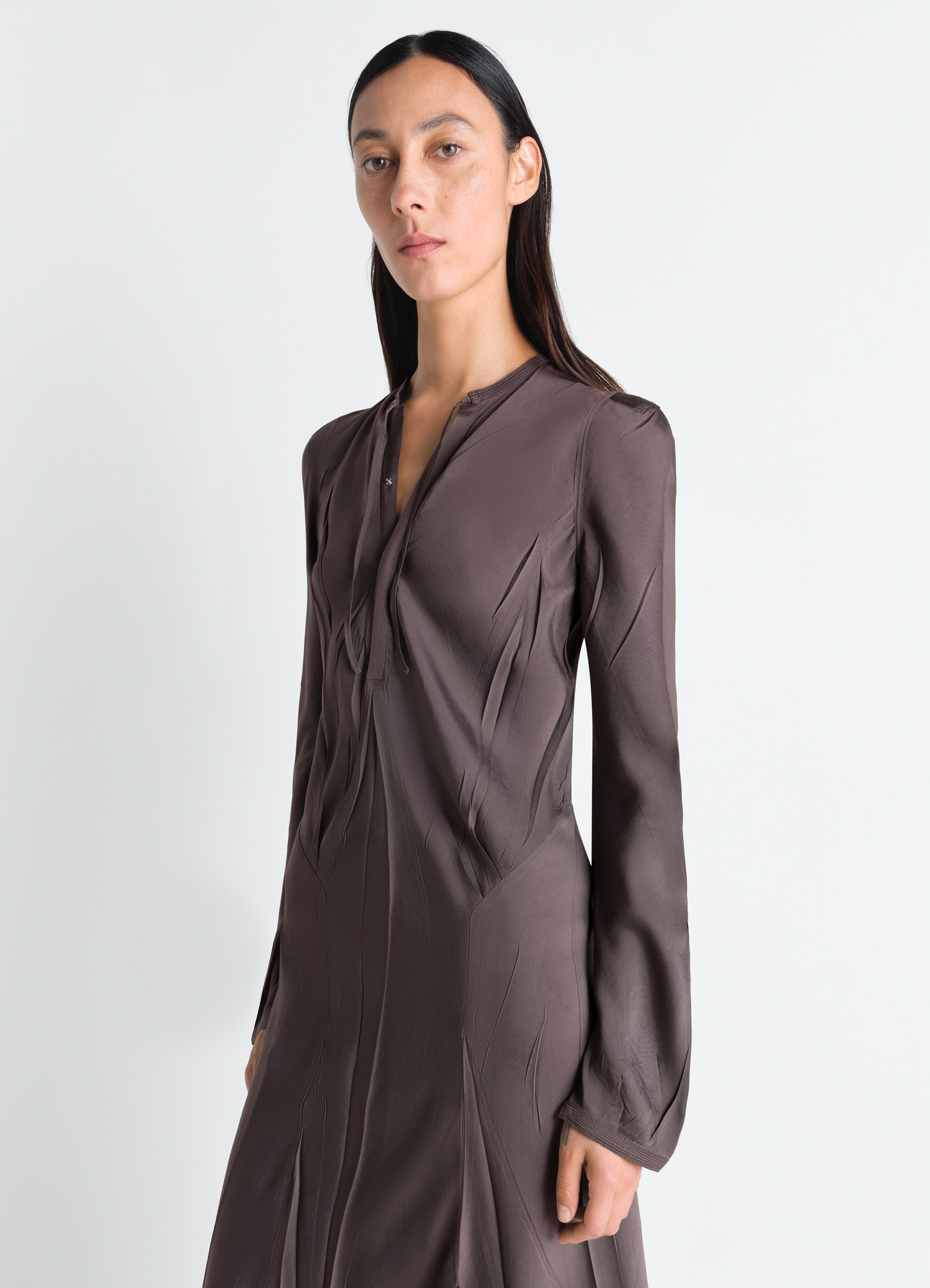 Creased bias dress in poly viscose twill, model shot, three-quarter view long sleeves, gathered neckline