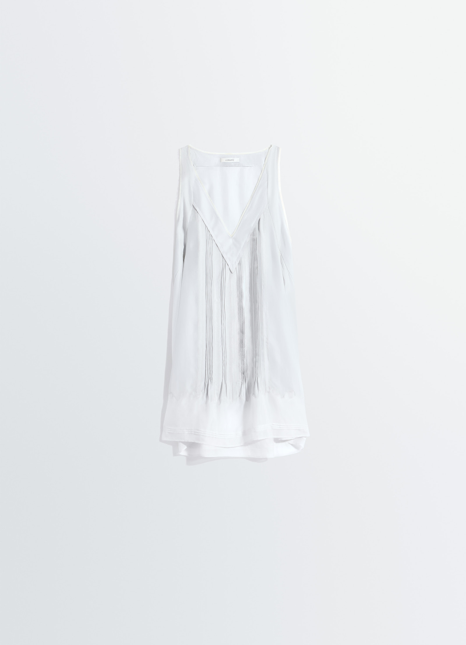 Lemaire sleep tunique dress in silk pongee, product shot, hanging front angle fringed v-neck sleeveless