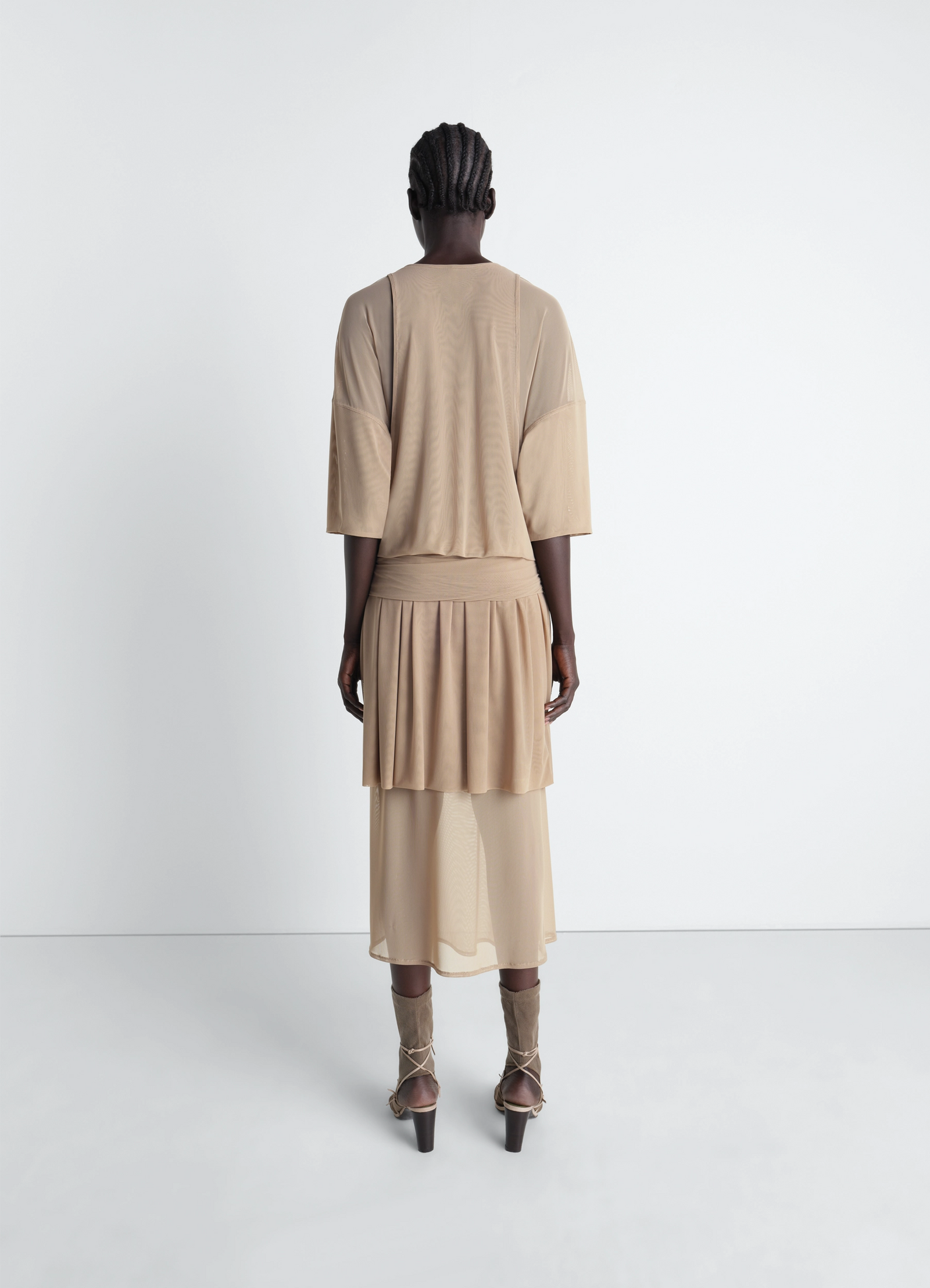 Double layer dress in mesh in transparent mesh, model shot, back view draped flowing silhouette