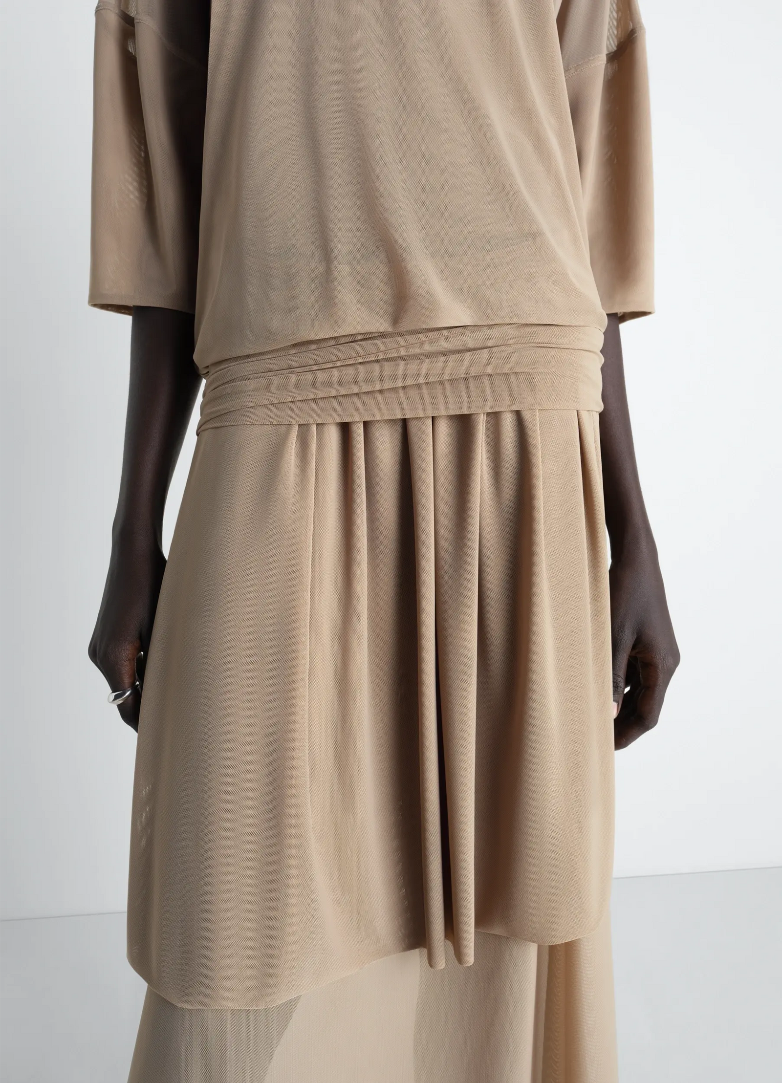 Double layer dress in mesh in transparent mesh, model shot, close-up detail draping waist detail