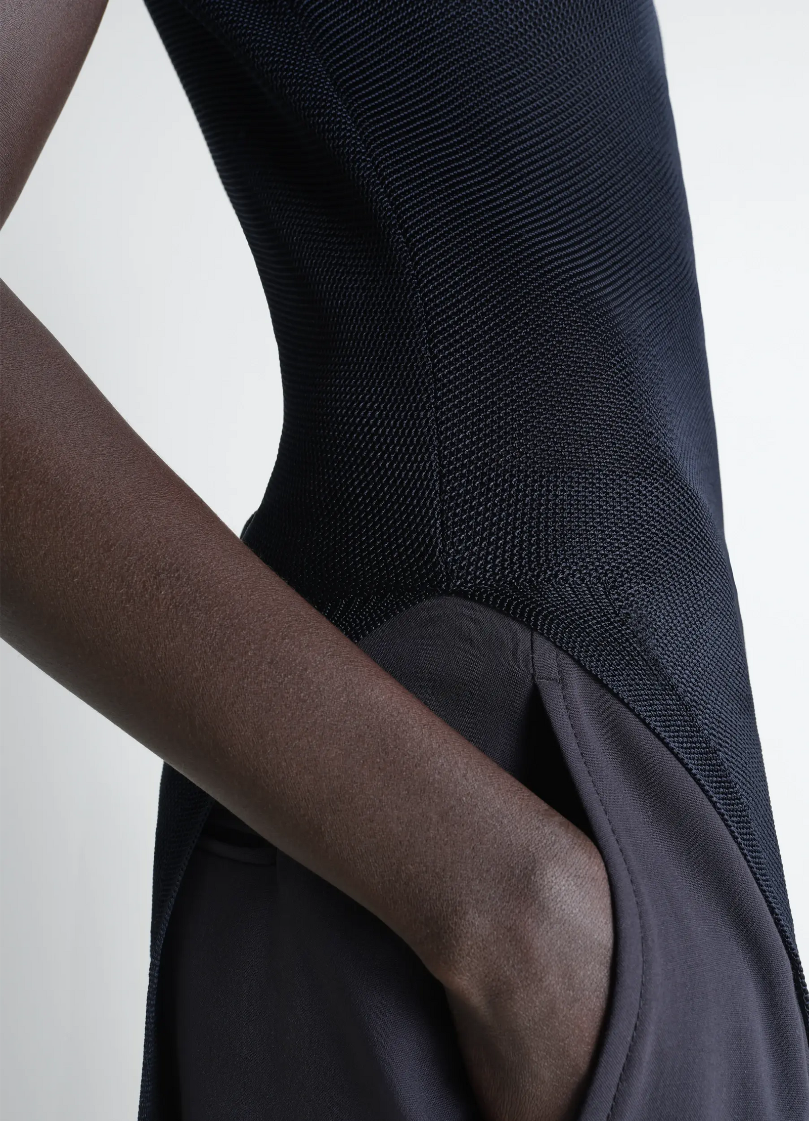 Lemaire column dress in shiny viscose, model shot, close-up side view textured fabric detail