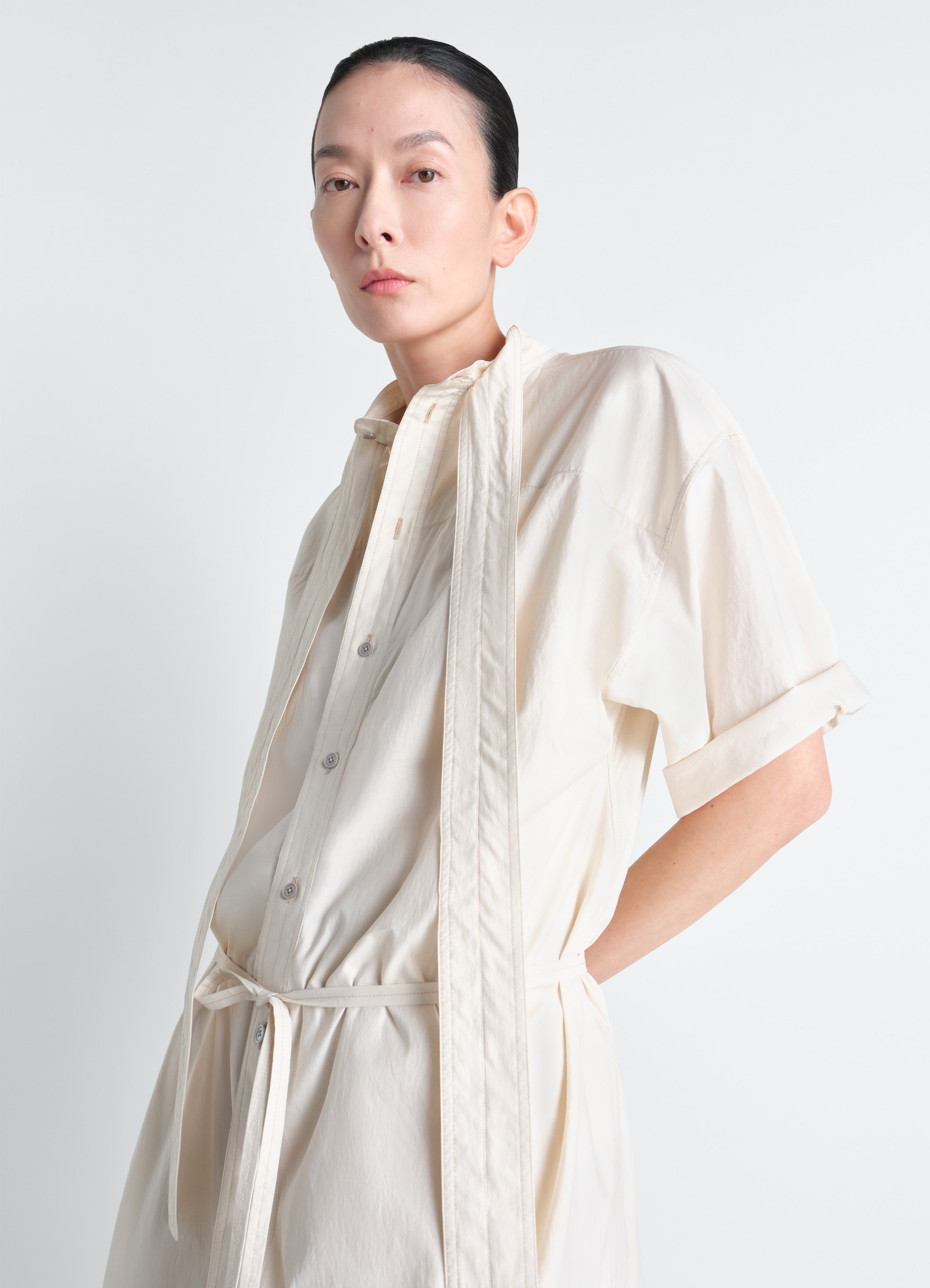 Reversible tube dress in washed cotton silk, model shot, side view buttoned front detail