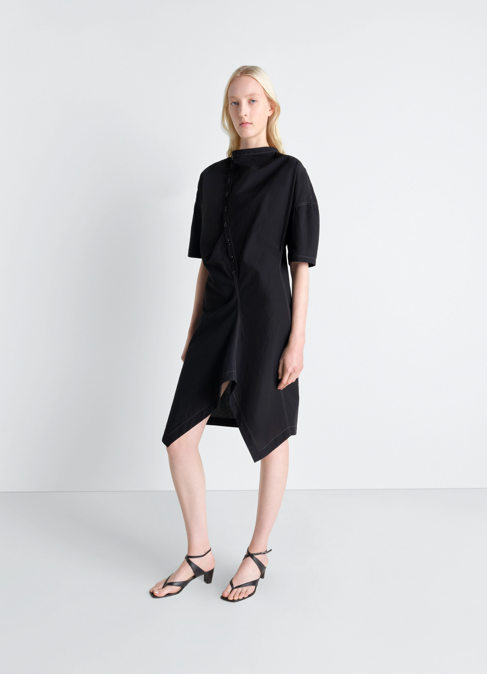Lemaire soft collar dress in crepe cotton, model shot, three-quarter view soft draped silhouette