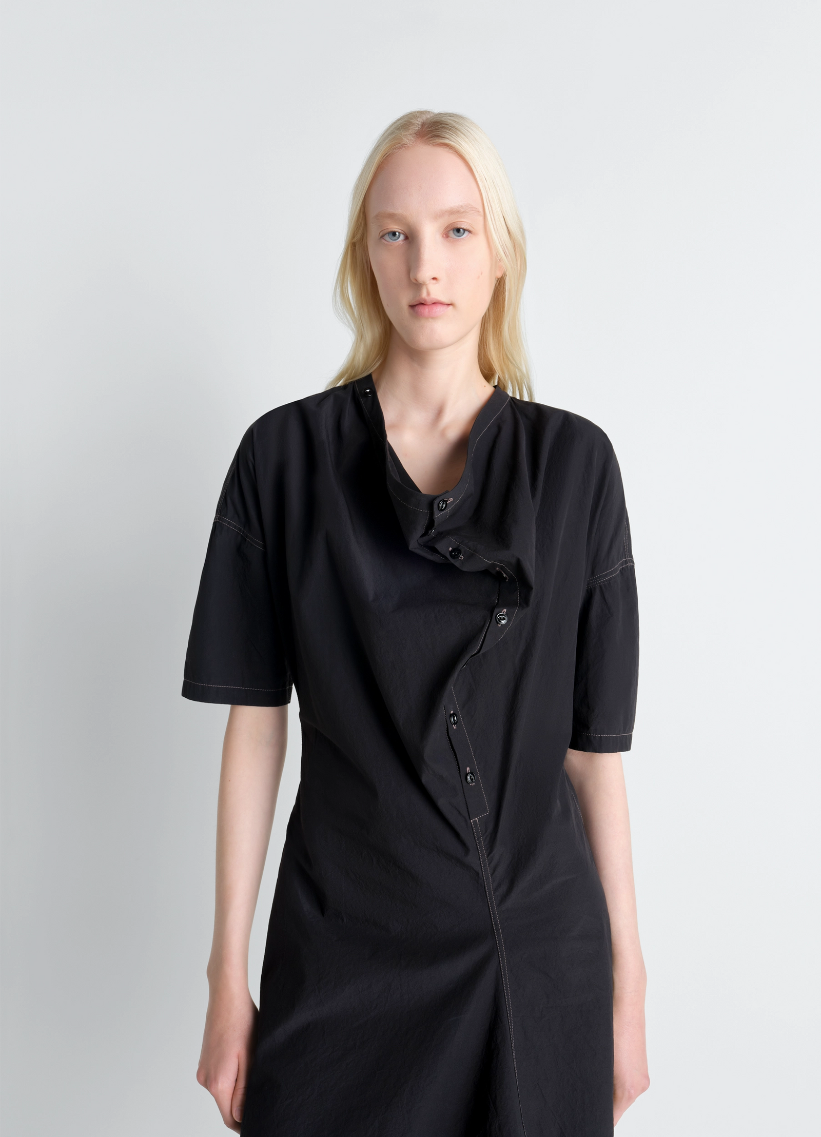 Lemaire soft collar dress in crepe cotton, model shot, close-up view draped button detail