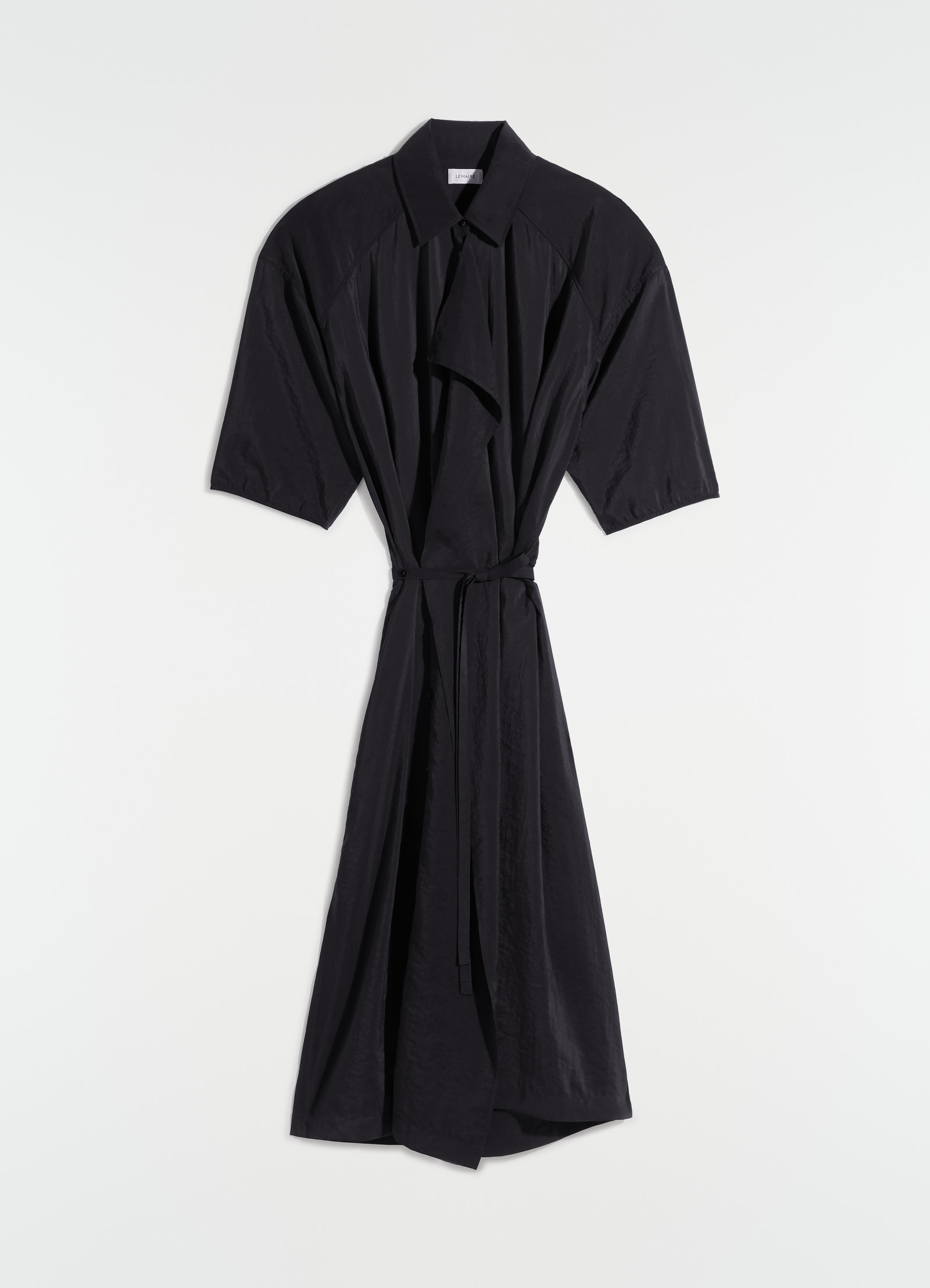 Asymmetrical shirt dress in dry silk, product shot, hanging front angled half sleeve, draped tie