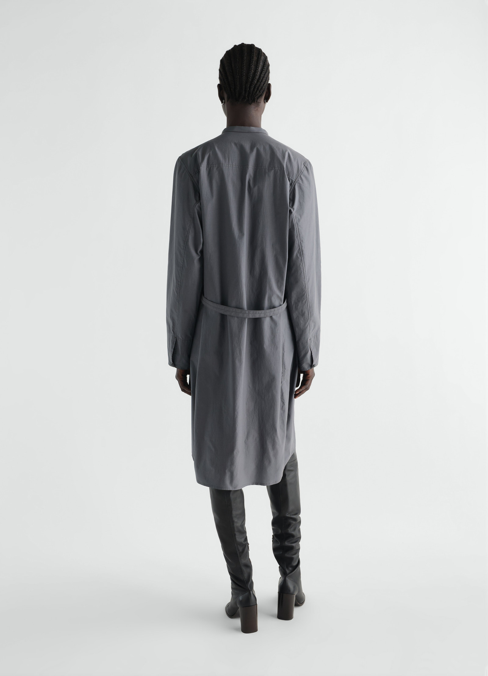 Sailor dress in washed grey cotton and silk blend by lemaire worn by model back view with high boots