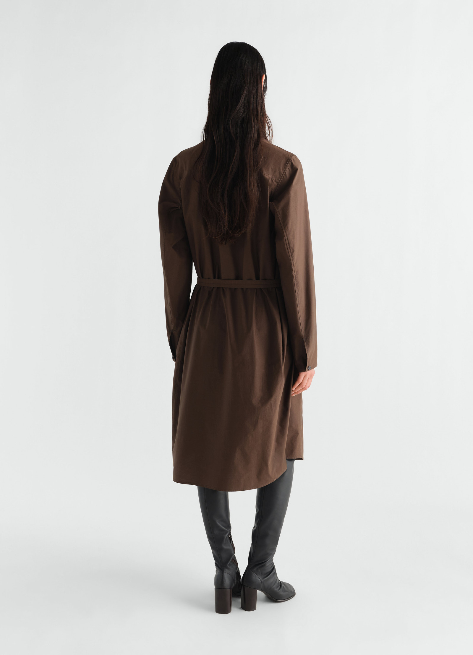 Sailor dress lemaire in washed brown cotton silk blend worn by model back view with belt and long sleeves