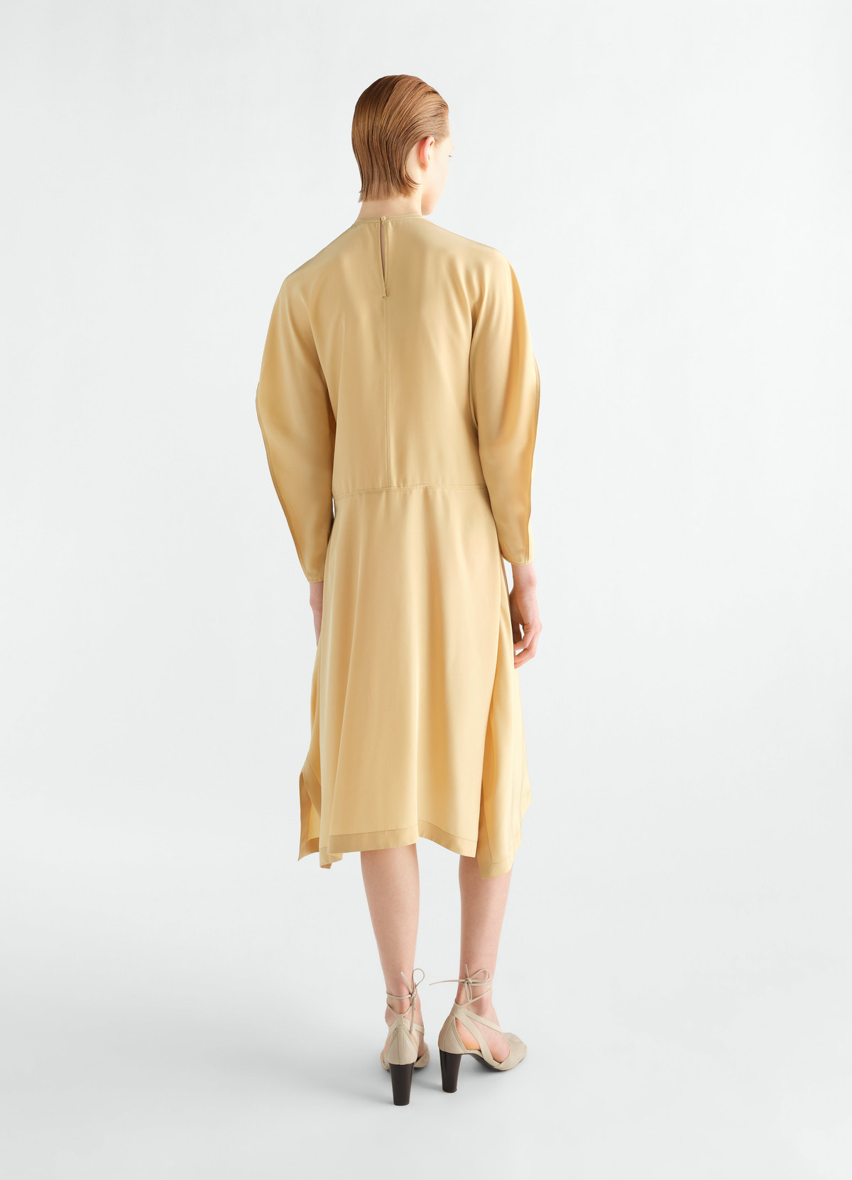 Midi dress in beige silk and viscose cloth lemaire back view worn by a model