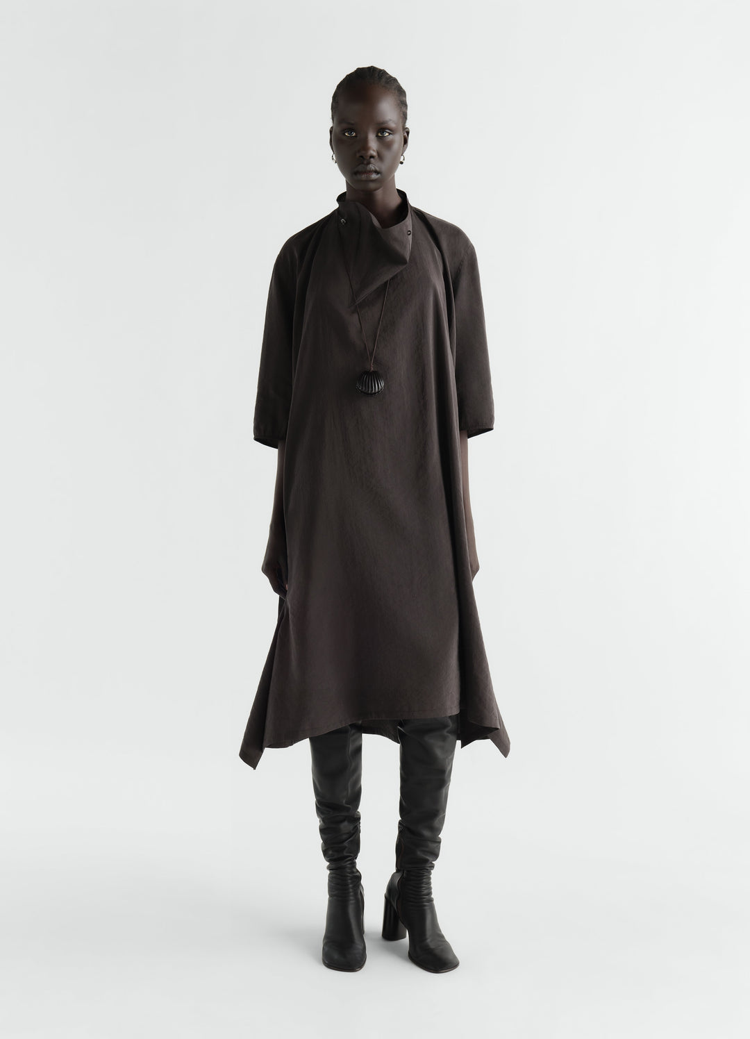Soft-collar brown dry silk dress worn by model with black boots LEMAIRE front view on white background