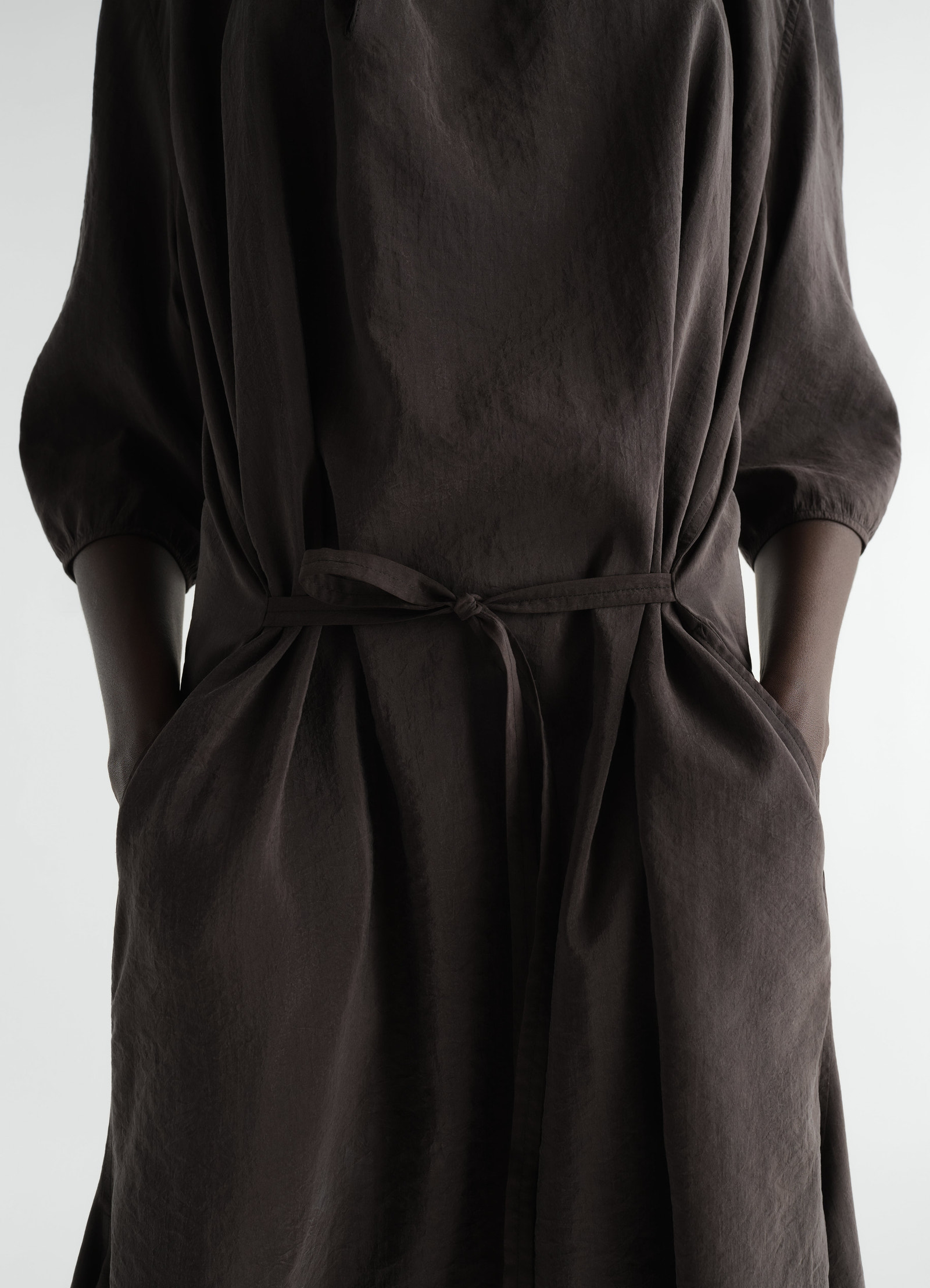 Soft-collar brown dry silk dress with belt and pockets worn by model front view lemaire