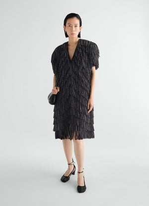 Fringed black snake printed dry silk dress lemaire worn by model front with v-neck and short sleeves