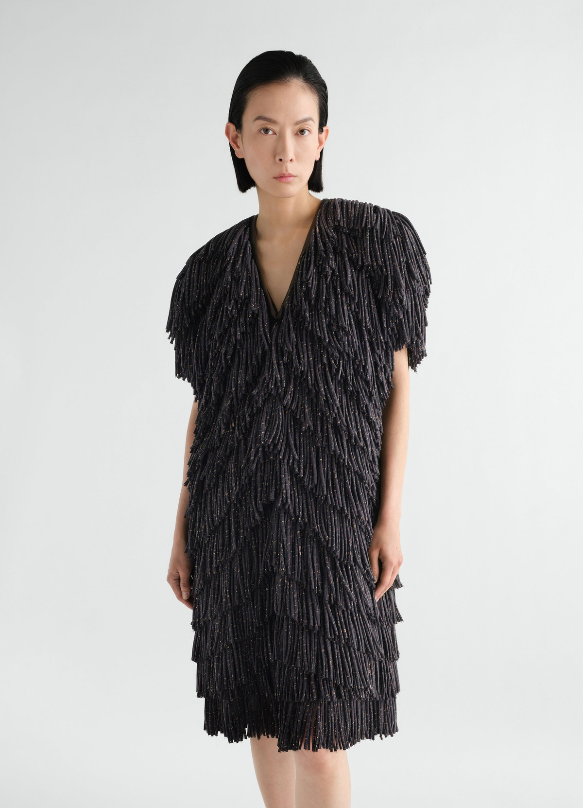 Fringed dry silk dress in black snake print worn by a model front view lemaire