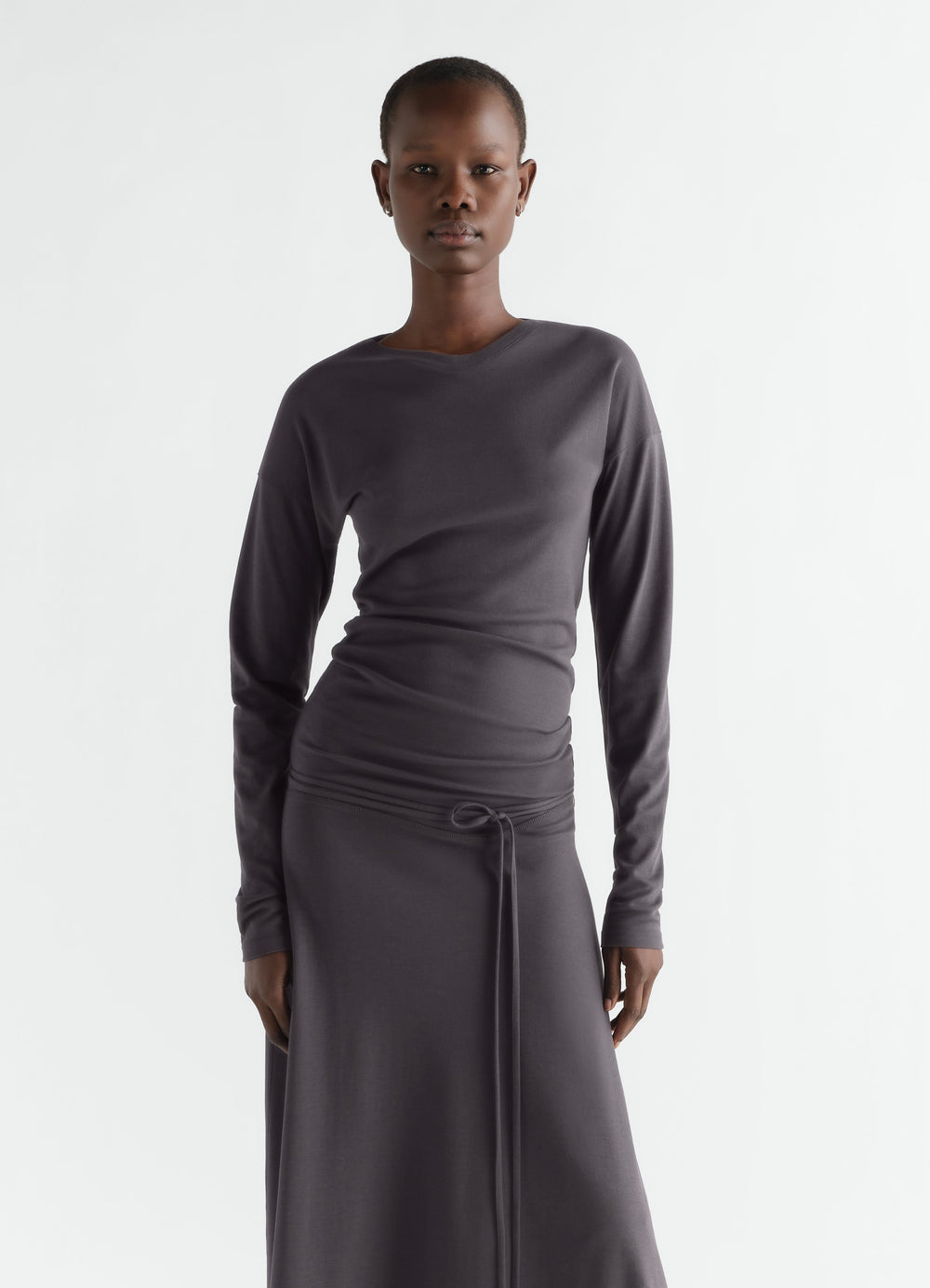 Fluid long-sleeve dark grey silky jersey crepe dress LEMAIRE worn by model front view