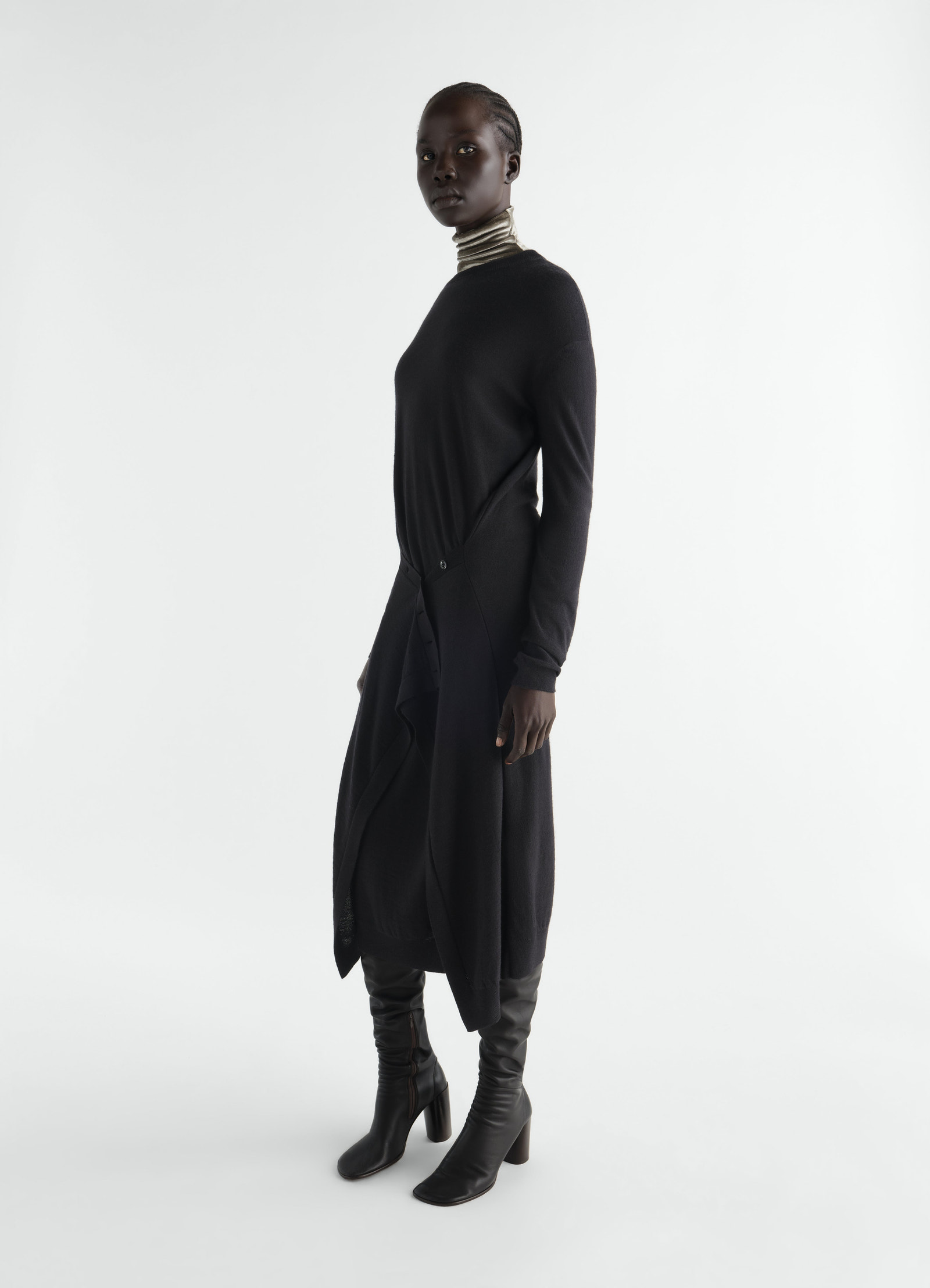 Buttoned black merino wool blend dress with long sleeves worn by model side view lemaire