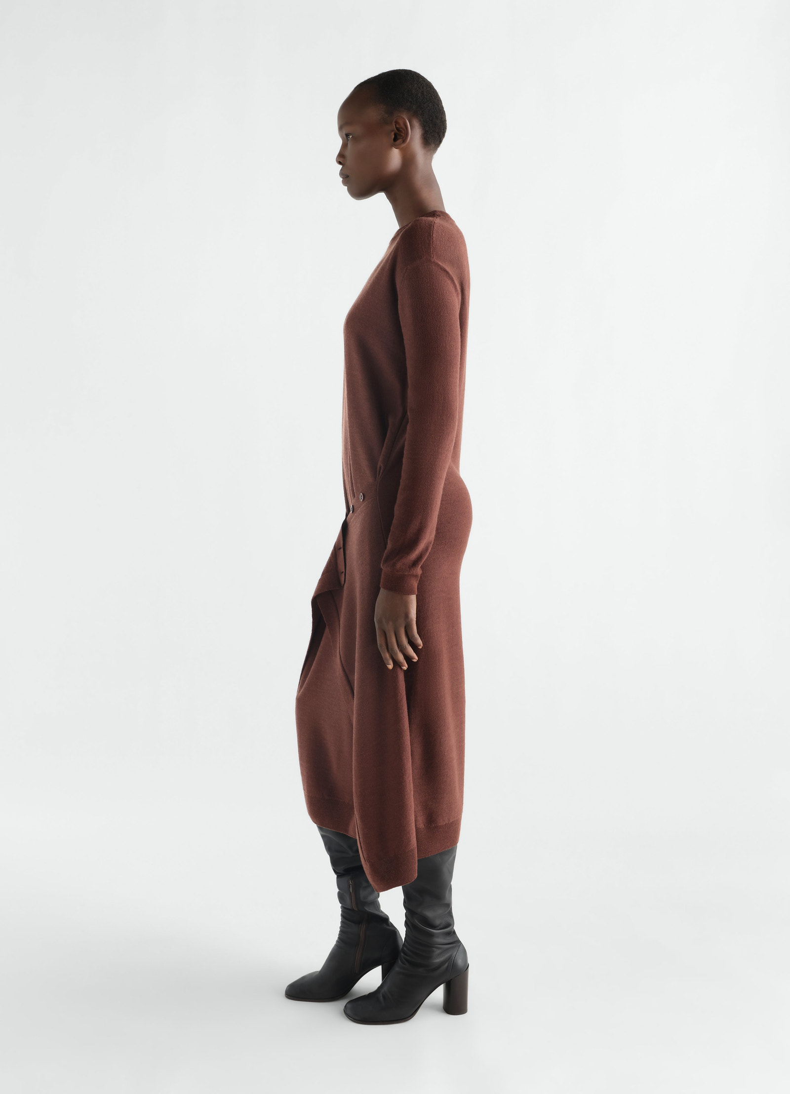 Buttoned brown merino wool blend dress worn by model side view lemaire with black heeled boots