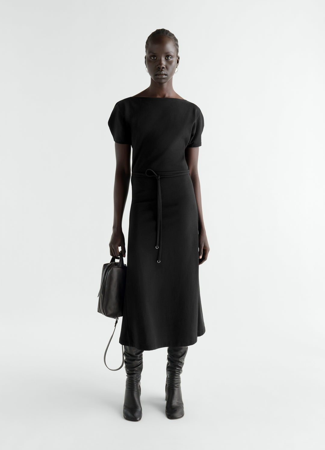 Belted black heavy cotton jersey dress by LEMAIRE worn by model front with short sleeves and crew neck