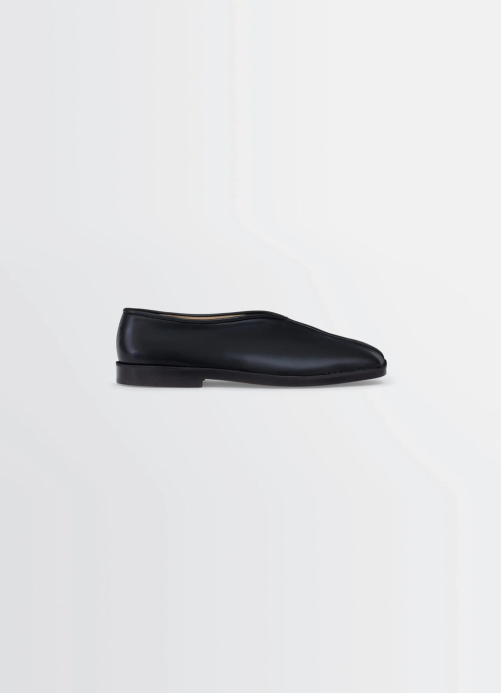 Lemaire Piped Slippers in Black Nappa Lamb Leather, product shot, Side view Classic streamlined shape