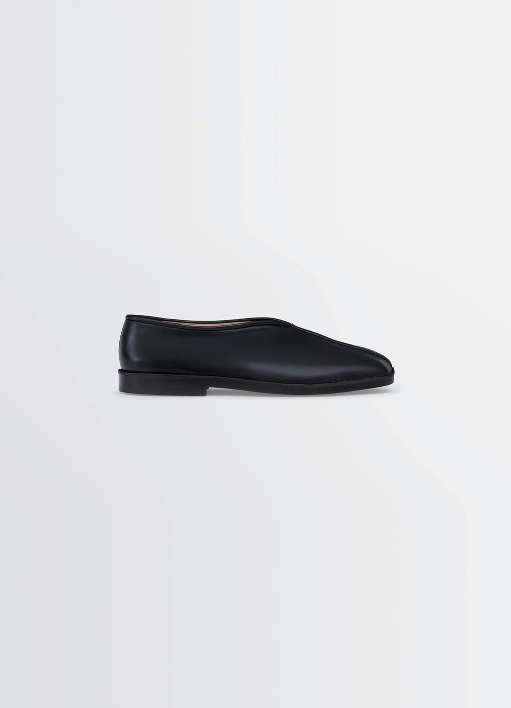 Lemaire Piped Slippers in Black Nappa Lamb Leather, product shot, Side view Classic streamlined shape
