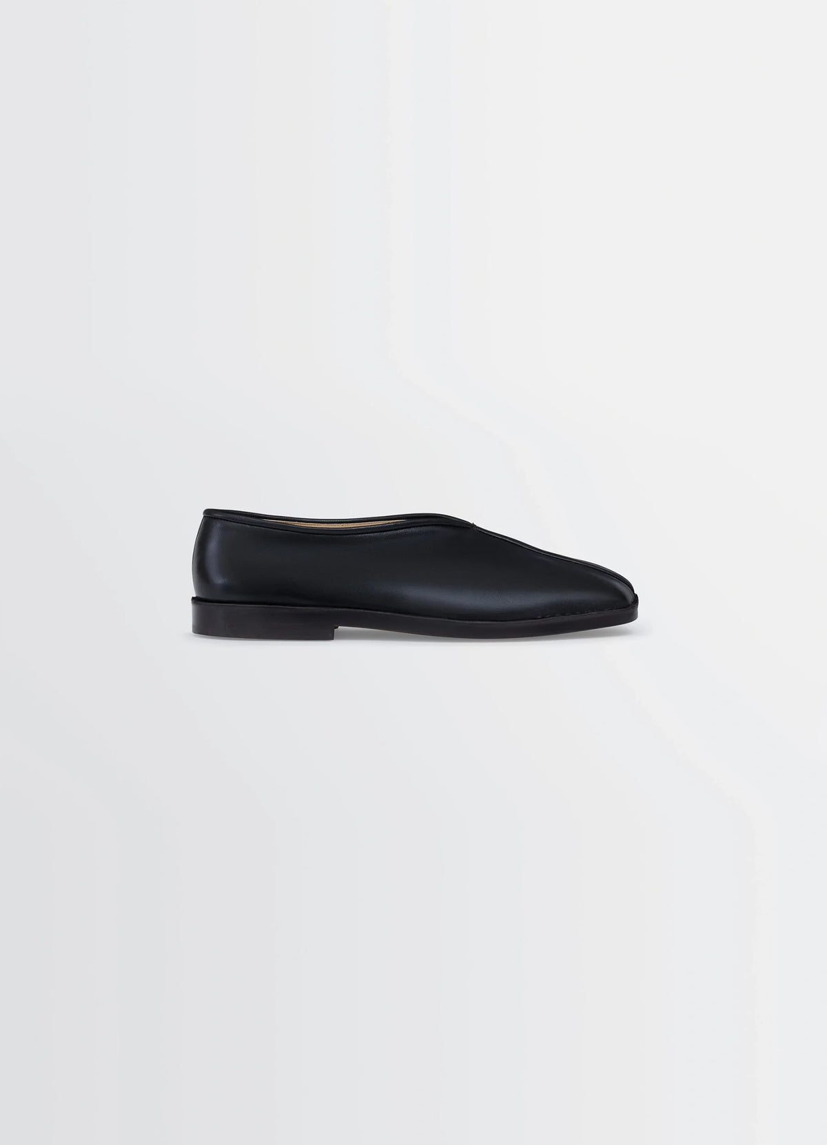 Lemaire Piped Slippers in Black Nappa Lamb Leather, product shot, Side view Classic streamlined shape