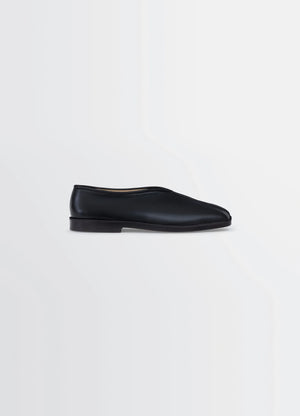 Lemaire Piped Slippers in Black Nappa Lamb Leather, product shot, Side view Classic streamlined shape