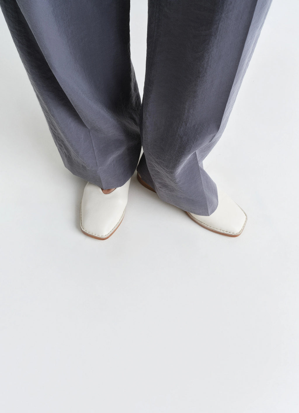 Lemaire Ballerina Shoes in Smooth Lamb Nappa Leather, model shot, top down view square toe design