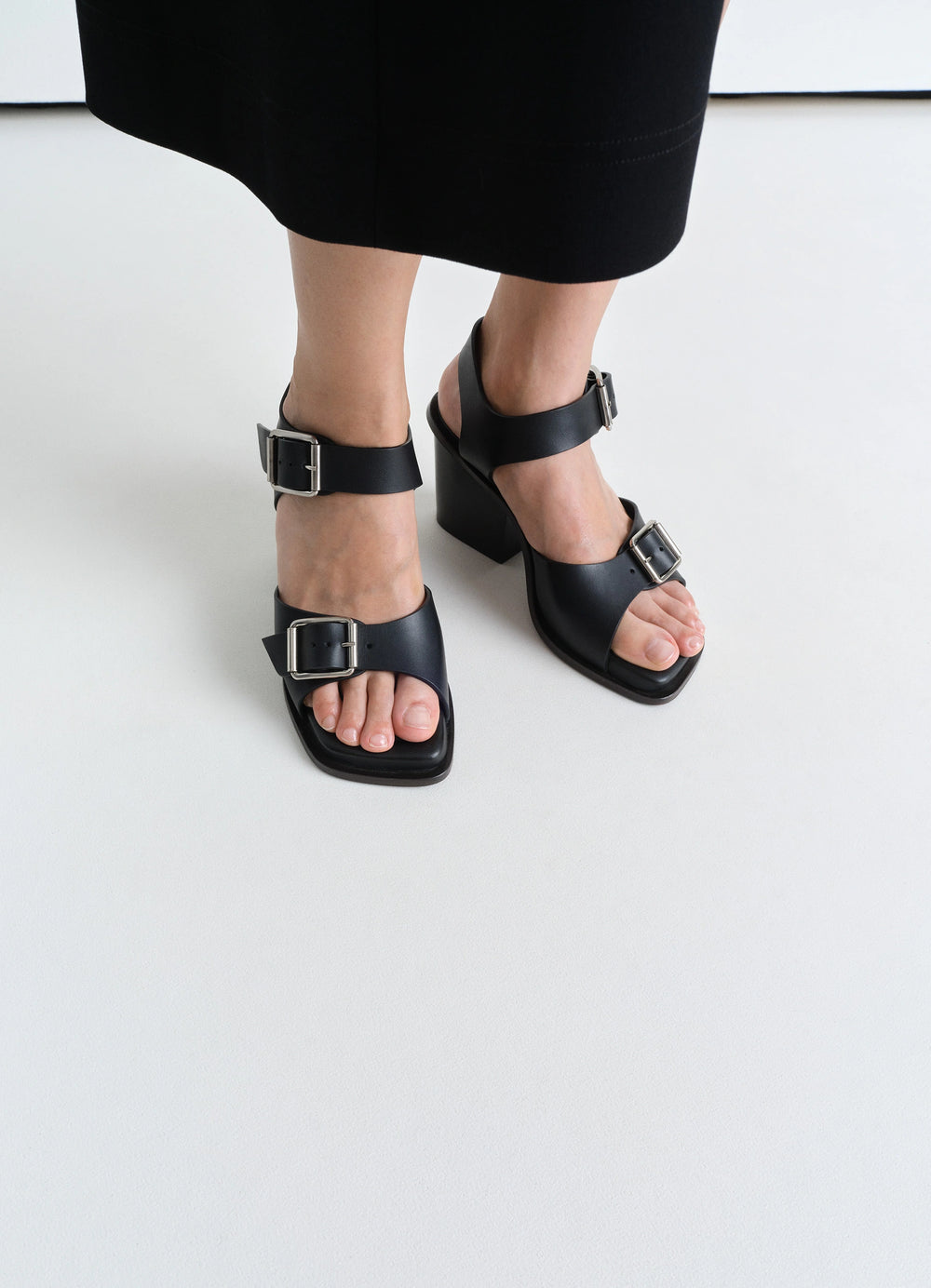 Square Heeled Sandals with Straps 8 in Smooth Vegetable-Tanned Leather, model shot, front downward view large buckle detail