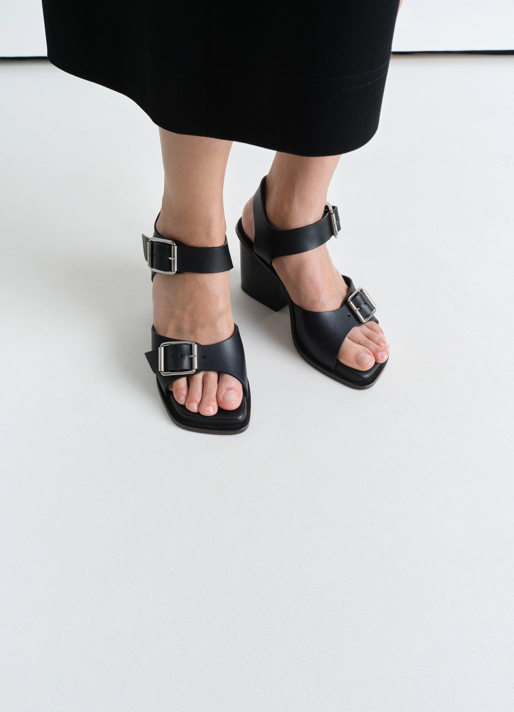 Square Heeled Sandals with Straps 8 in Smooth Vegetable-Tanned Leather, model shot, front downward view large buckle detail