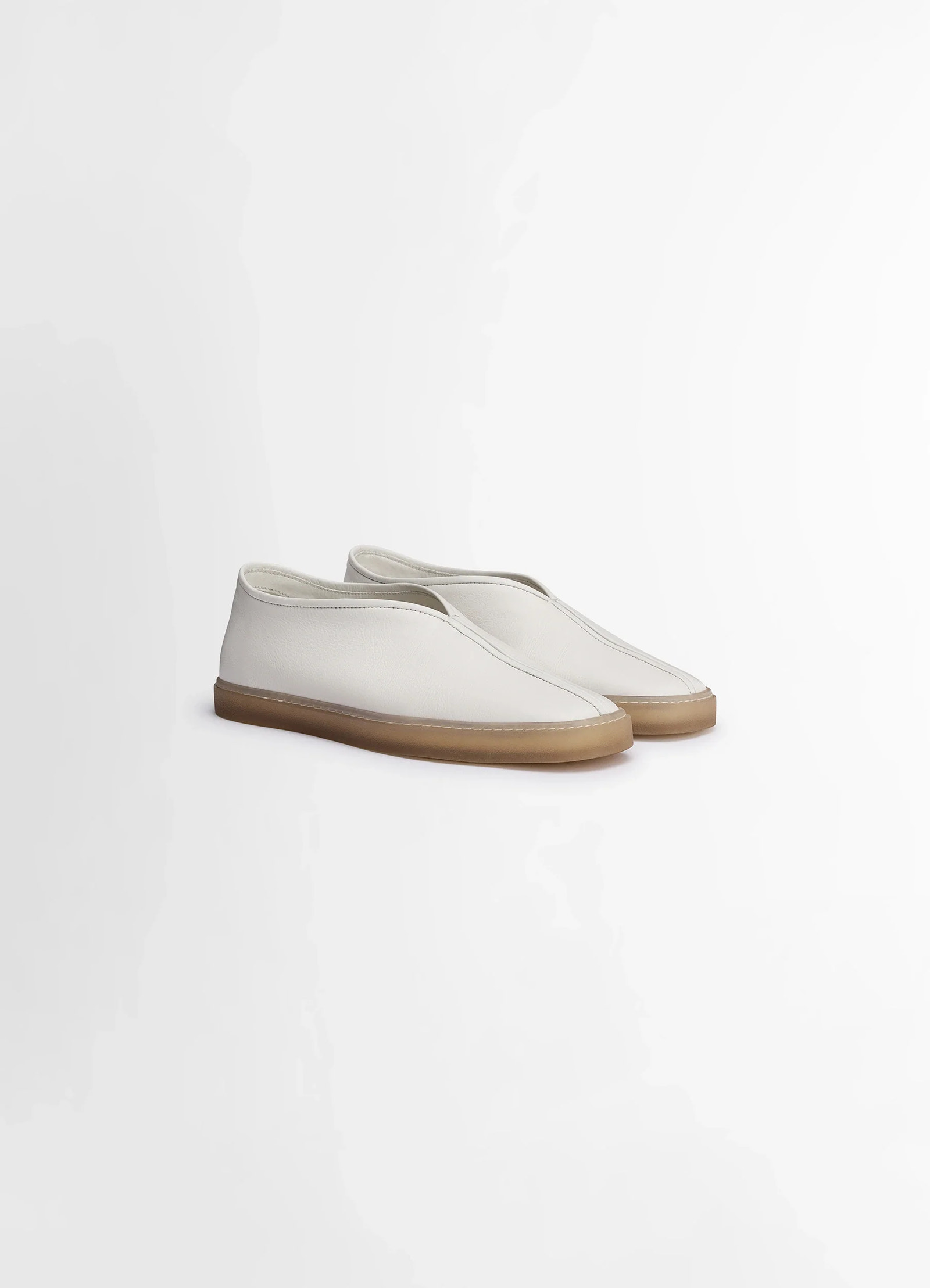 Lemaire linoleum piped sneakers in smooth soft cow leather, product shot, three-quarter front view gum sole neutral backgroun