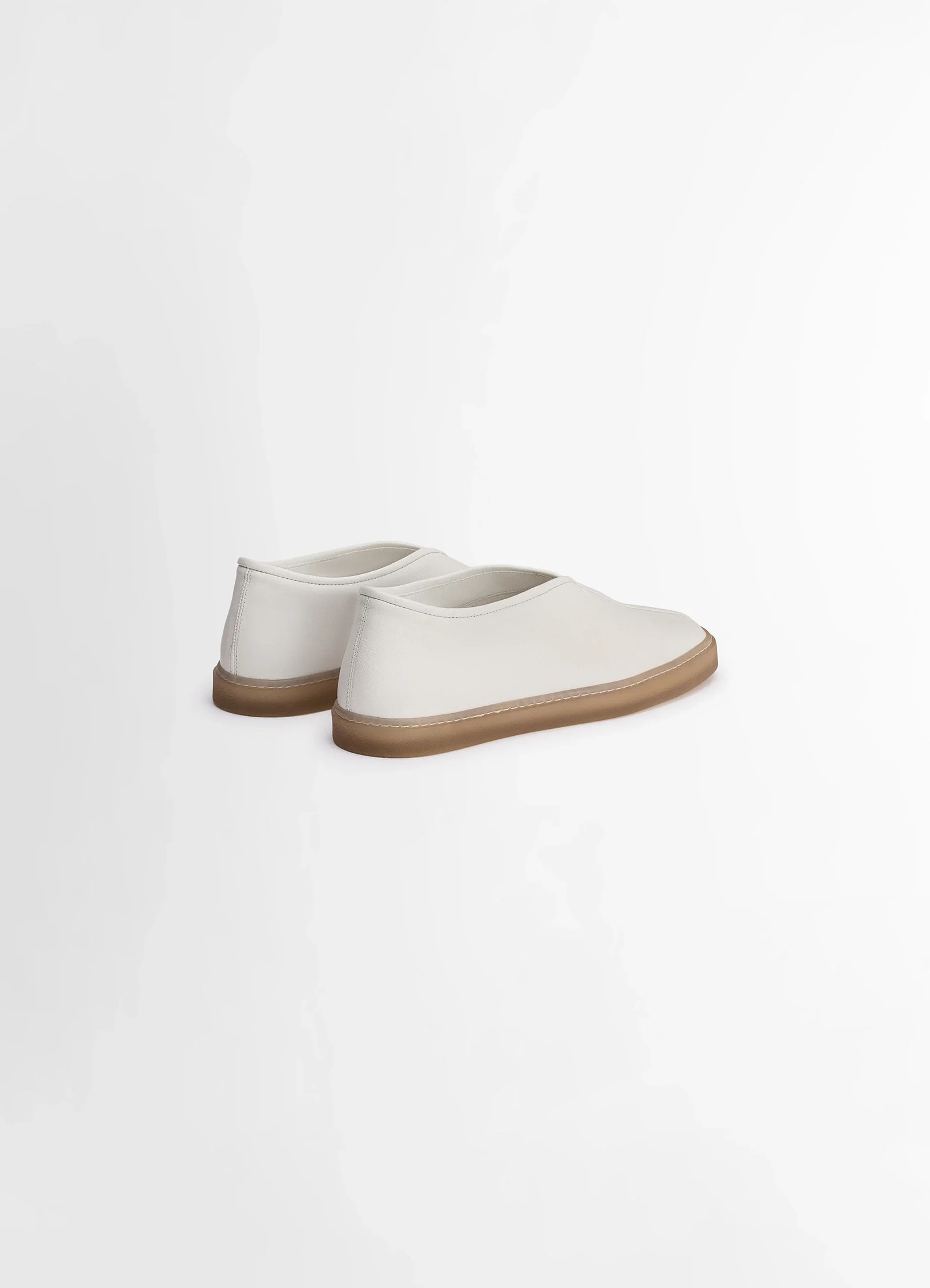 Lemaire linoleum piped sneakers in smooth soft cow leather, product shot, rear angle shot minimalist heel design
