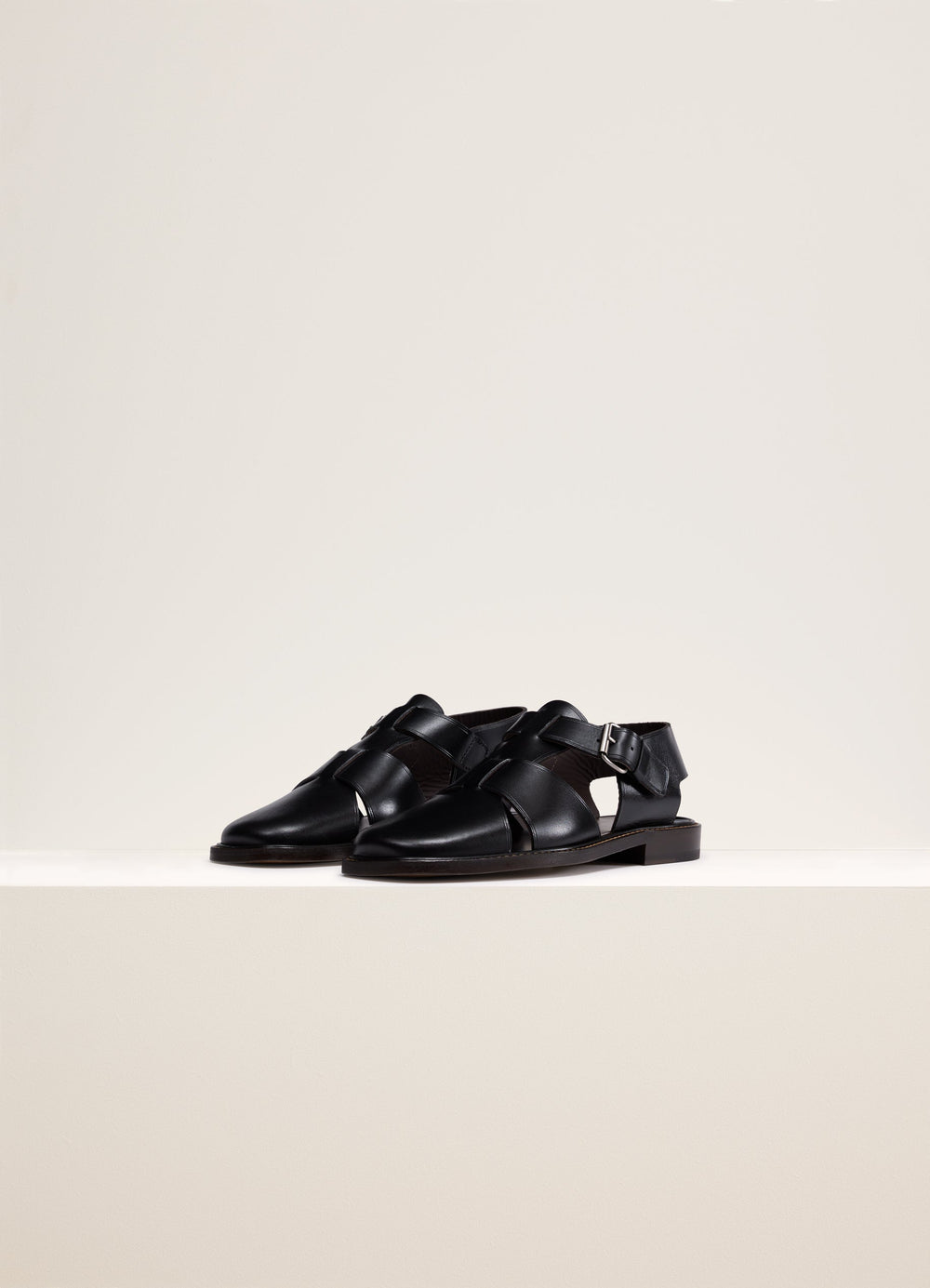 Lemaire Fisherman Sandals in Black Smooth Cow Leather, product shot, angled view cutout design