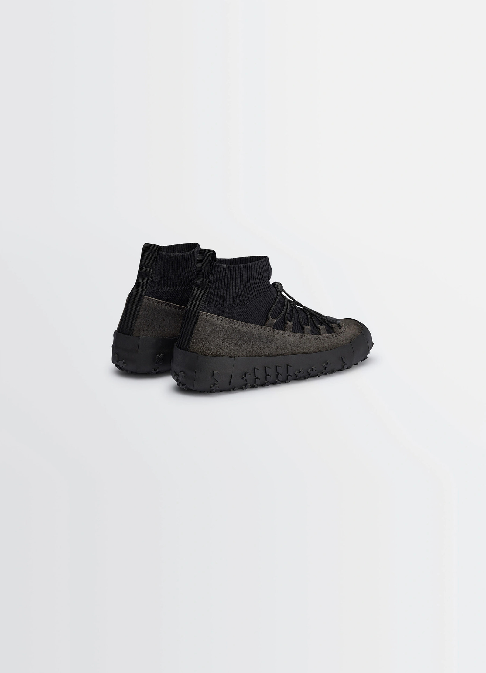 Vibram wrap on sneakers in black supple leather, product shot, rear three-quarter view ribbed ankle with loop