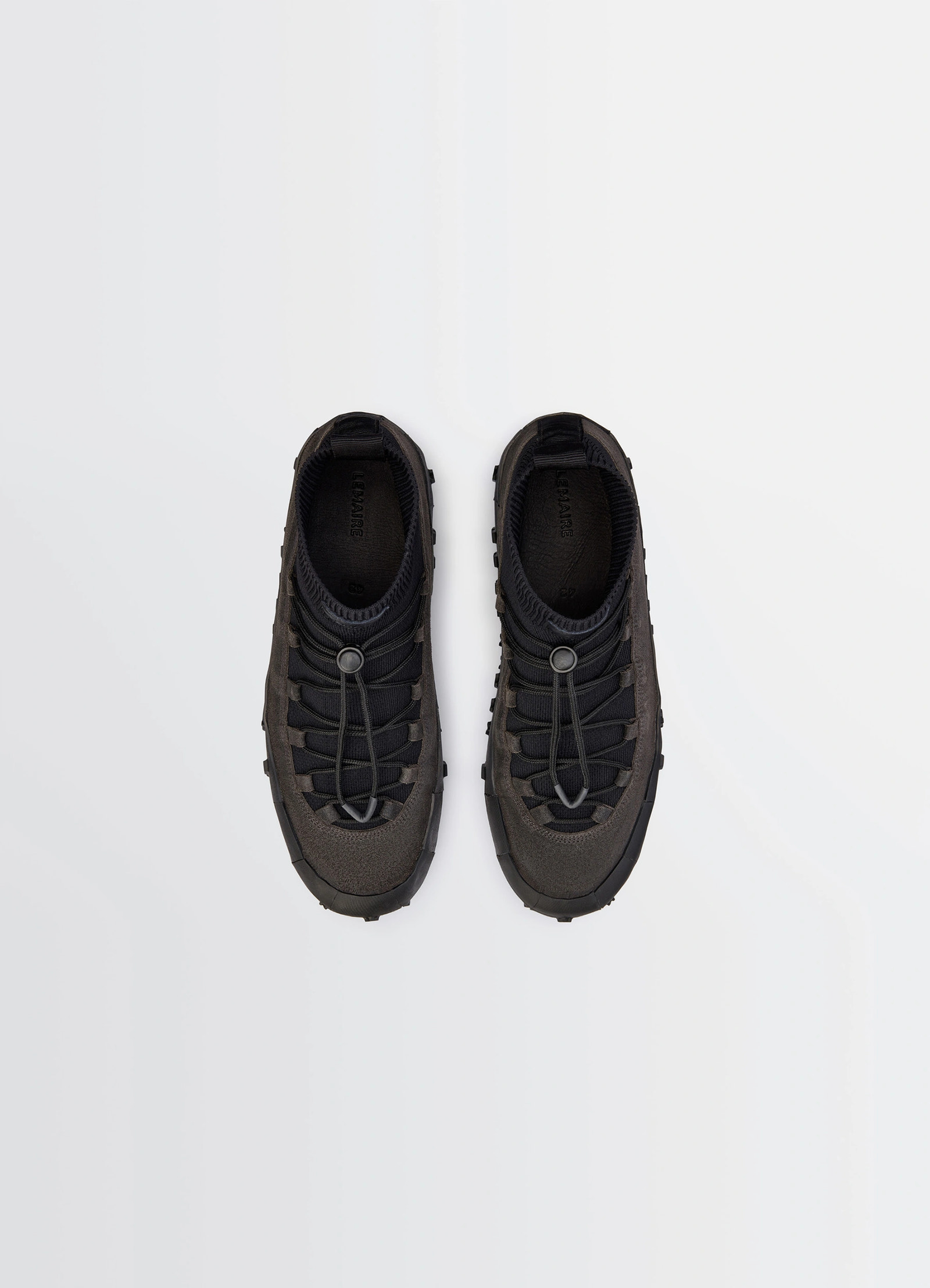 Vibram wrap on sneakers in black supple leather, product shot, top view lace-up with loop accent