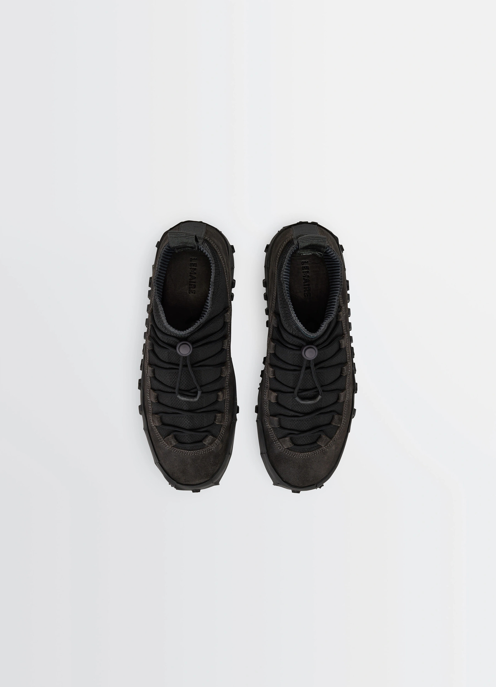 Vibram wrap on sneakers in black supple leather, product shot, top view contrasting laces, lug sole