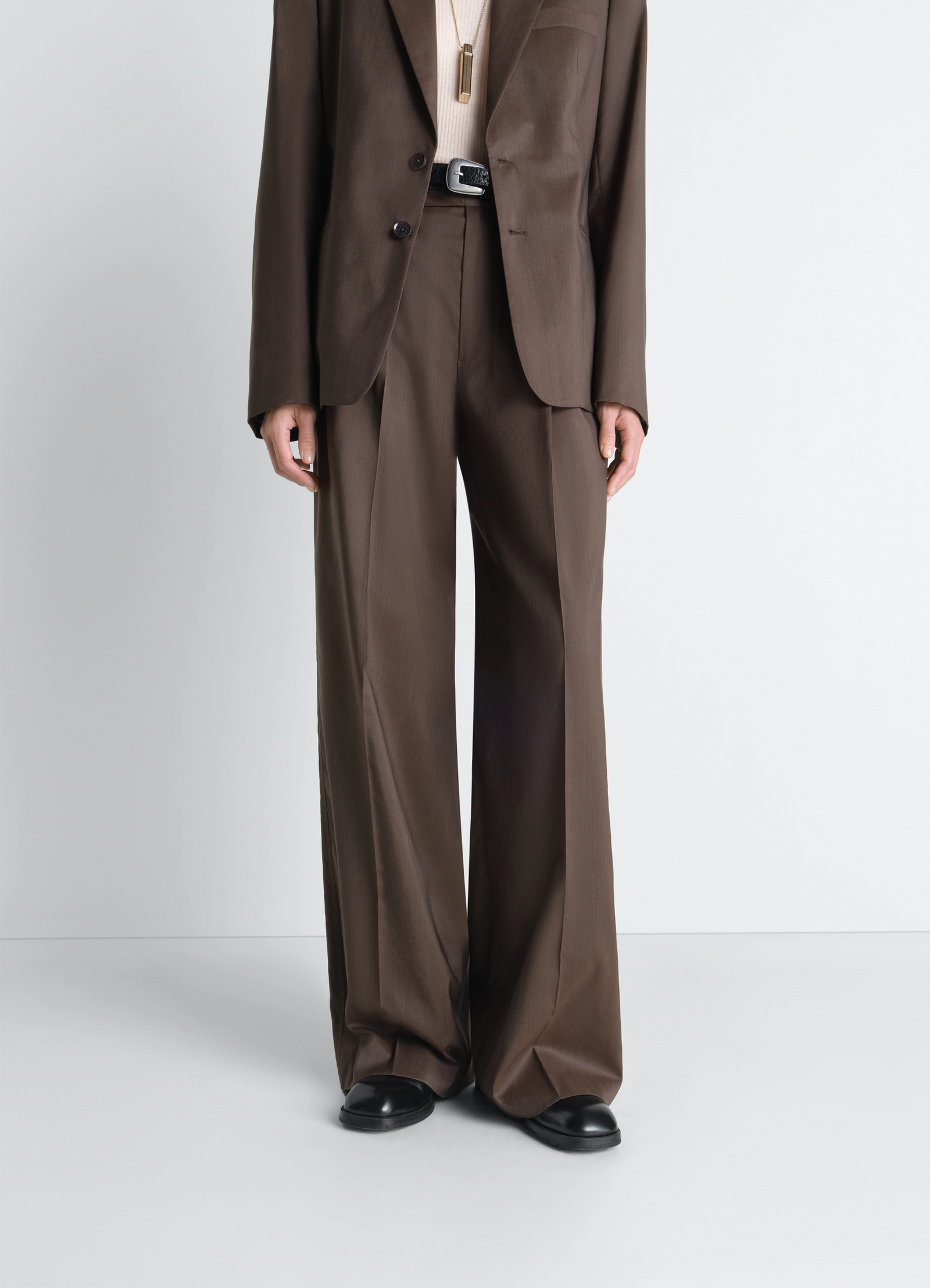 Zipped boots in leather in black calf leather, model shot, front view worn with wide pants