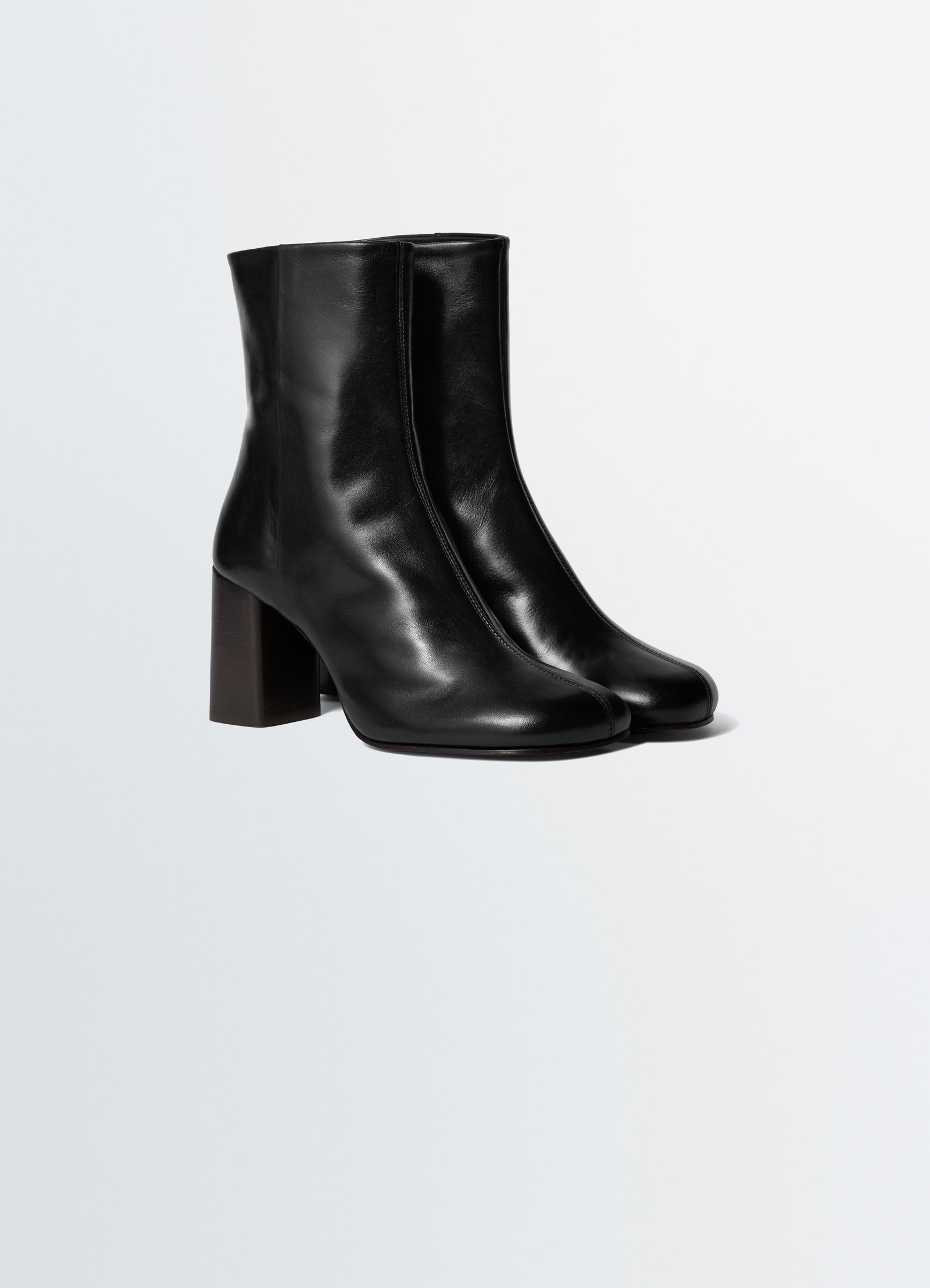 Anatomic black leather boots with 80mm heel by lemaire styled look on white background