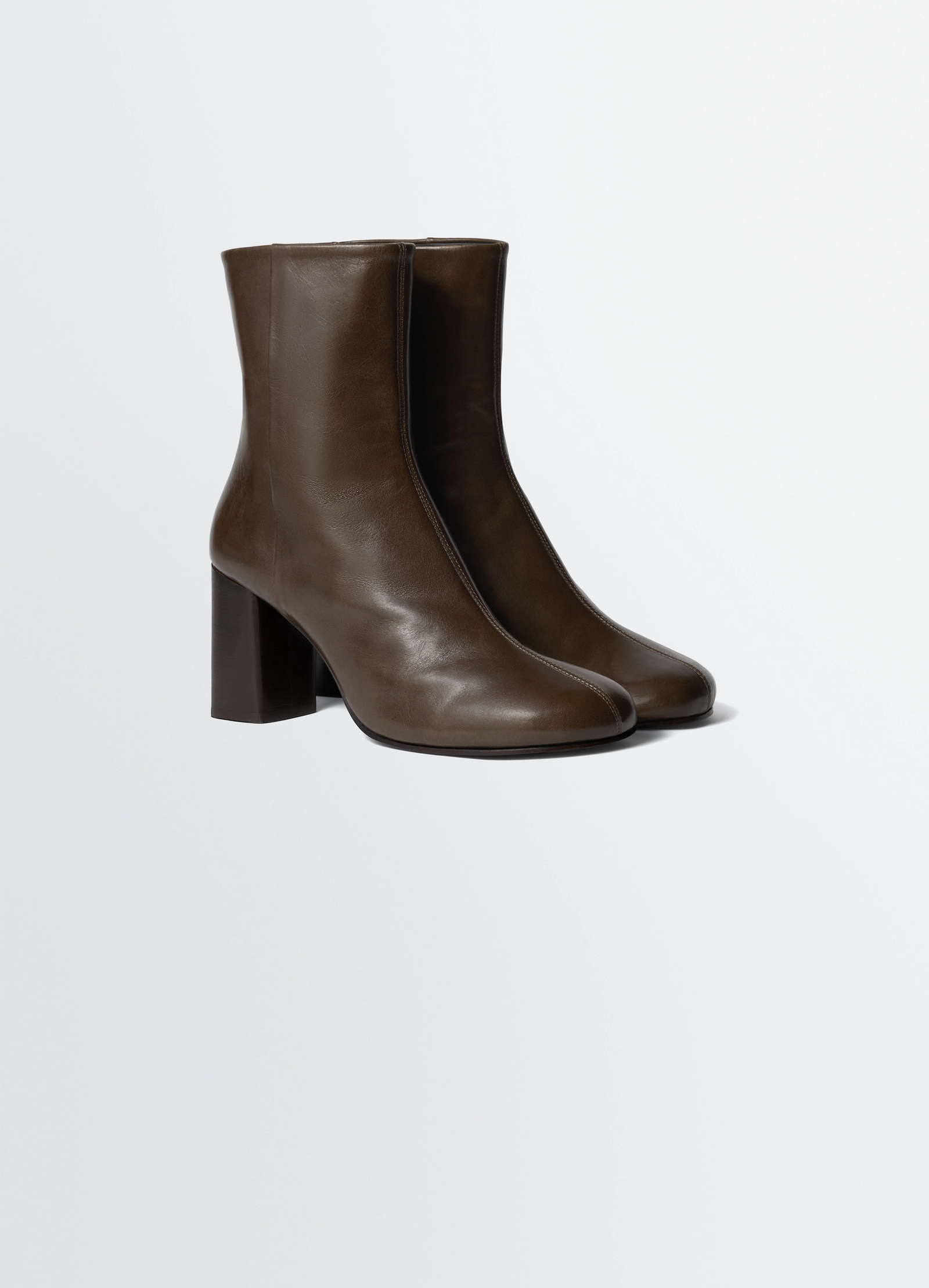 Lemaire anatomic boots in glossy vegetable-tanned leather, product shot, front three-quarter view squared top edge