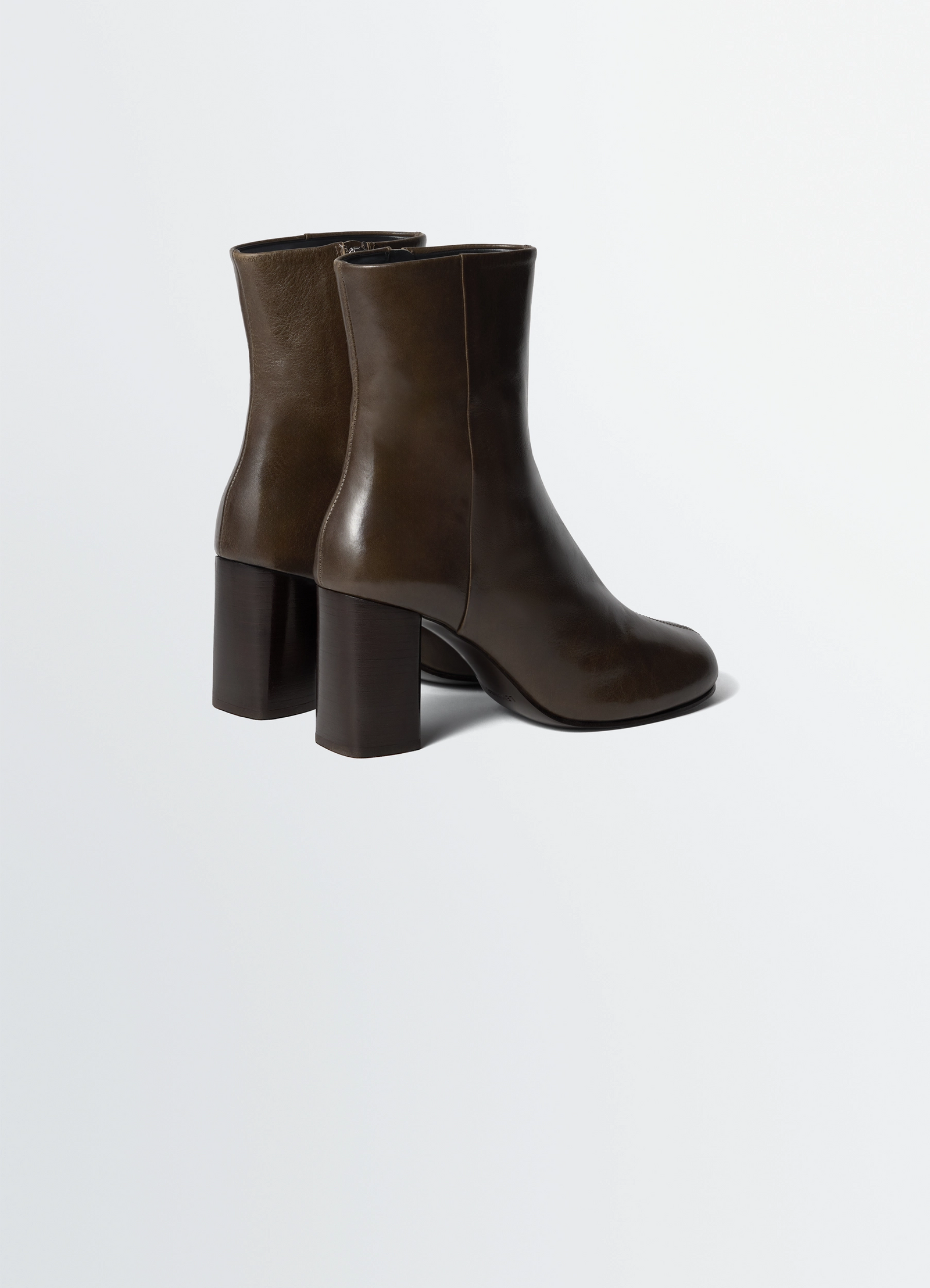 Lemaire anatomic boots in glossy vegetable-tanned leather, product shot, rear three-quarter view tall shaft design