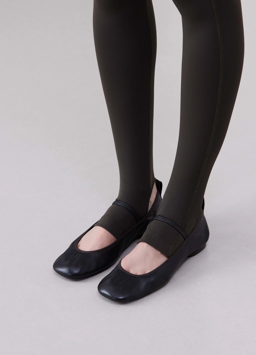 Lemaire Square Flat Ballerina in Nappa Leather, model shot, three-quarter front view elastic strap detail