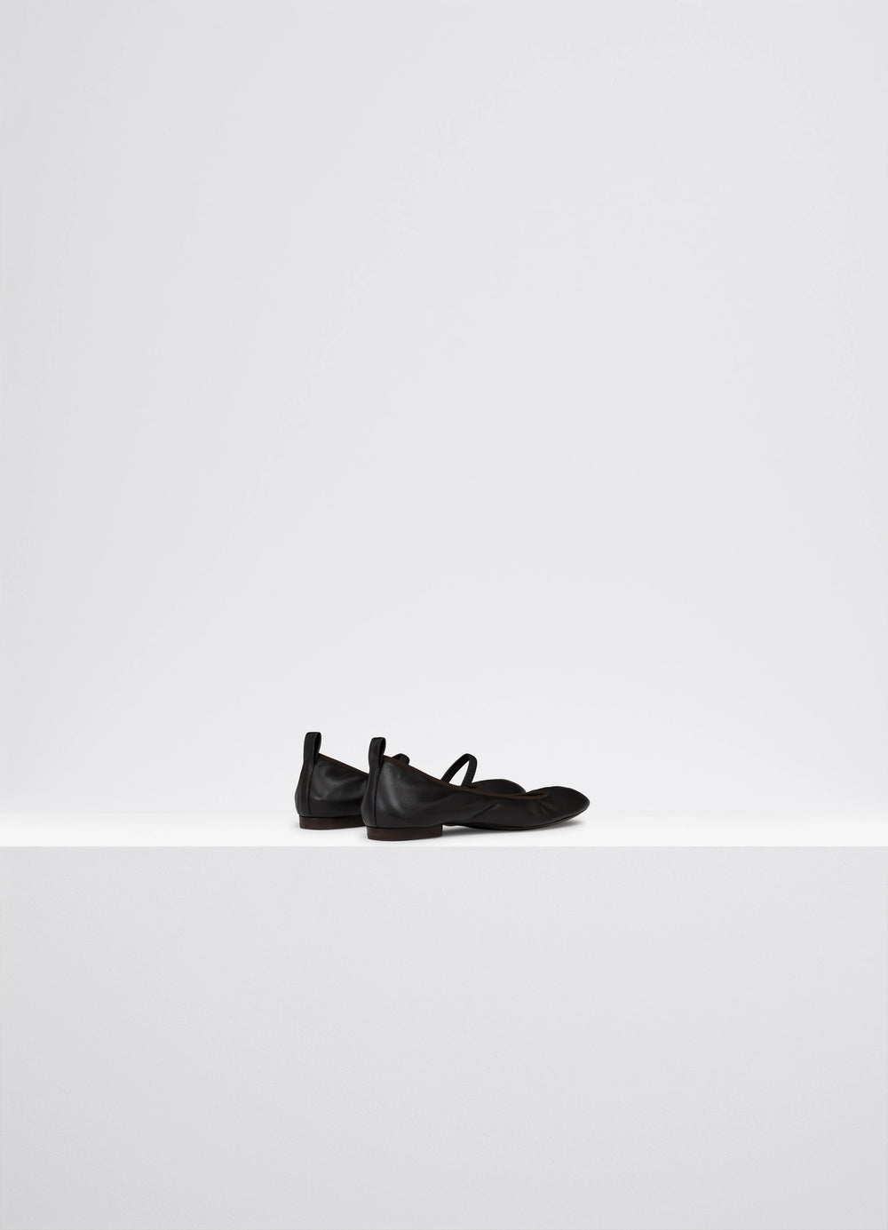 Lemaire Square Flat Ballerina in Black Nappa leather, product shot, back angled view round toe, flat heel
