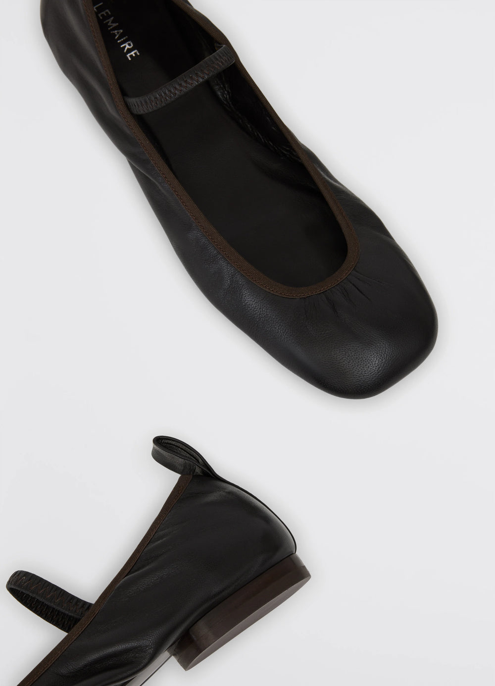 Lemaire Square Flat Ballerina in Black Nappa leather, product shot, top down view leather tab detail