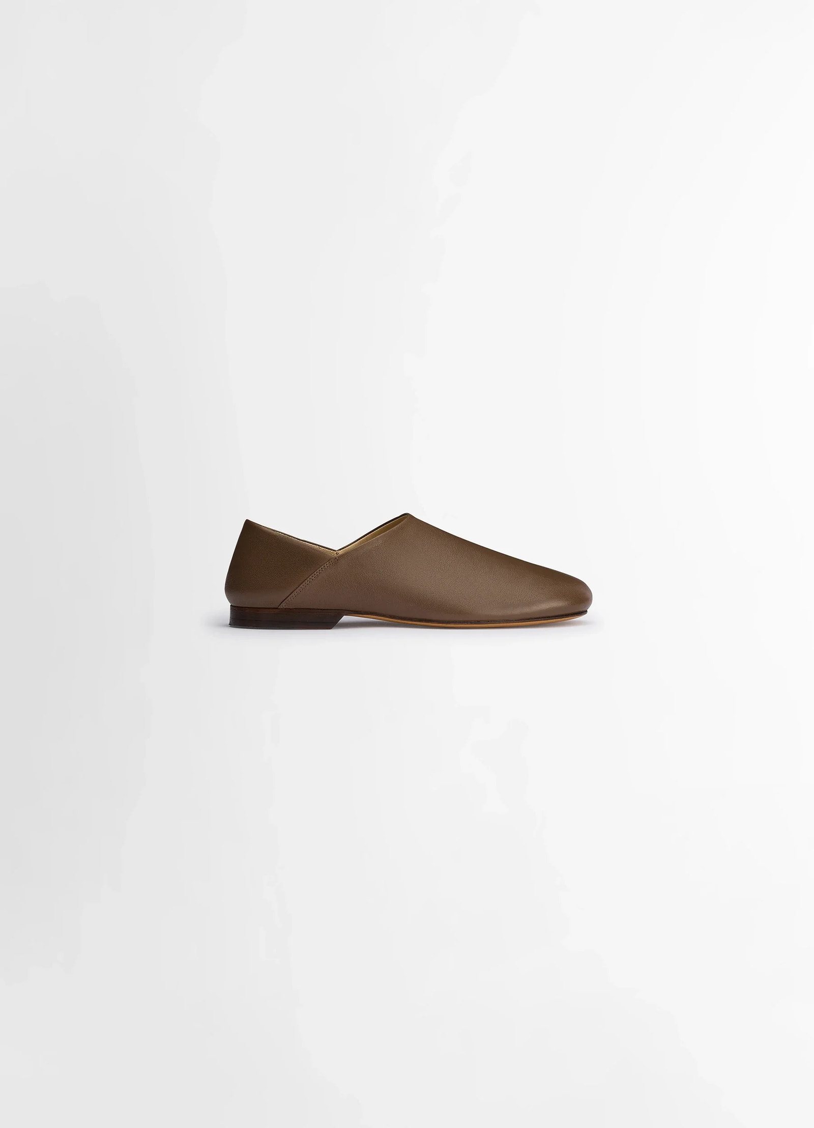 Lemaire slippers in shiny buffalo leather, product shot, side view slip-on or loafer