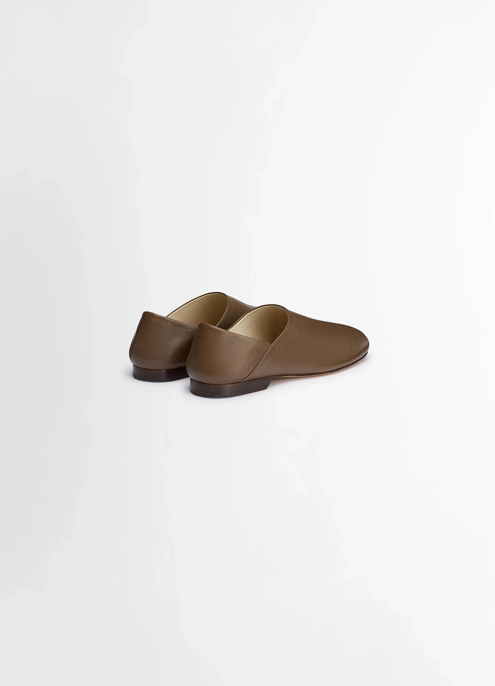 Lemaire slippers in shiny buffalo leather, product shot, back view low heel design