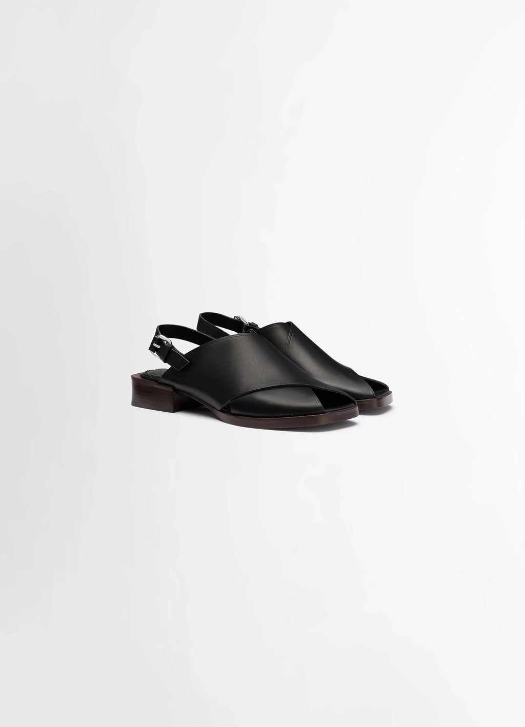 Lemaire Cross Flat Sandals in Black Vegetable Nappa Leather, product shot, three-quarter view adjustable ankle strap