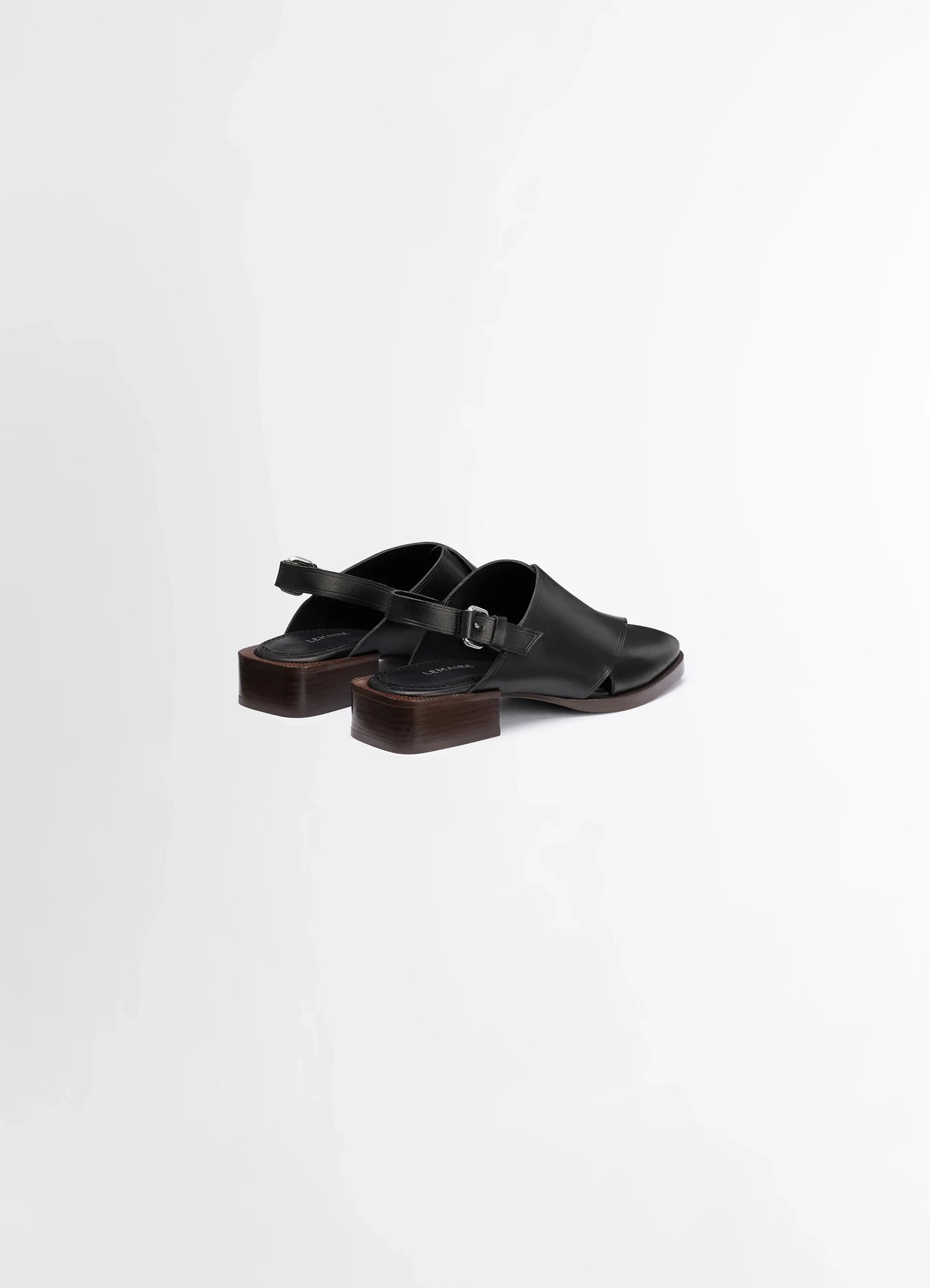 Lemaire cross flat sandals in black vegetable nappa leather, product shot, rear view slender heel design