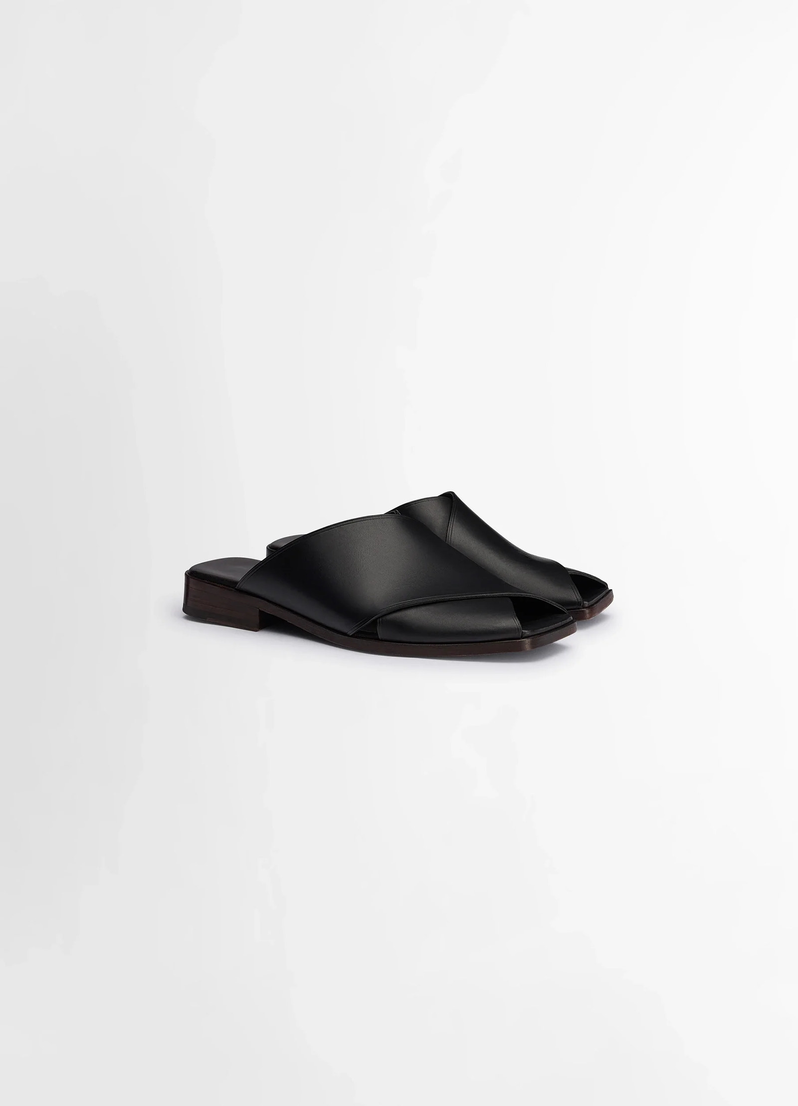 Lemaire cross flat sandals in soft shiny vegetable nappa, product shot, angled top view smooth leather finish