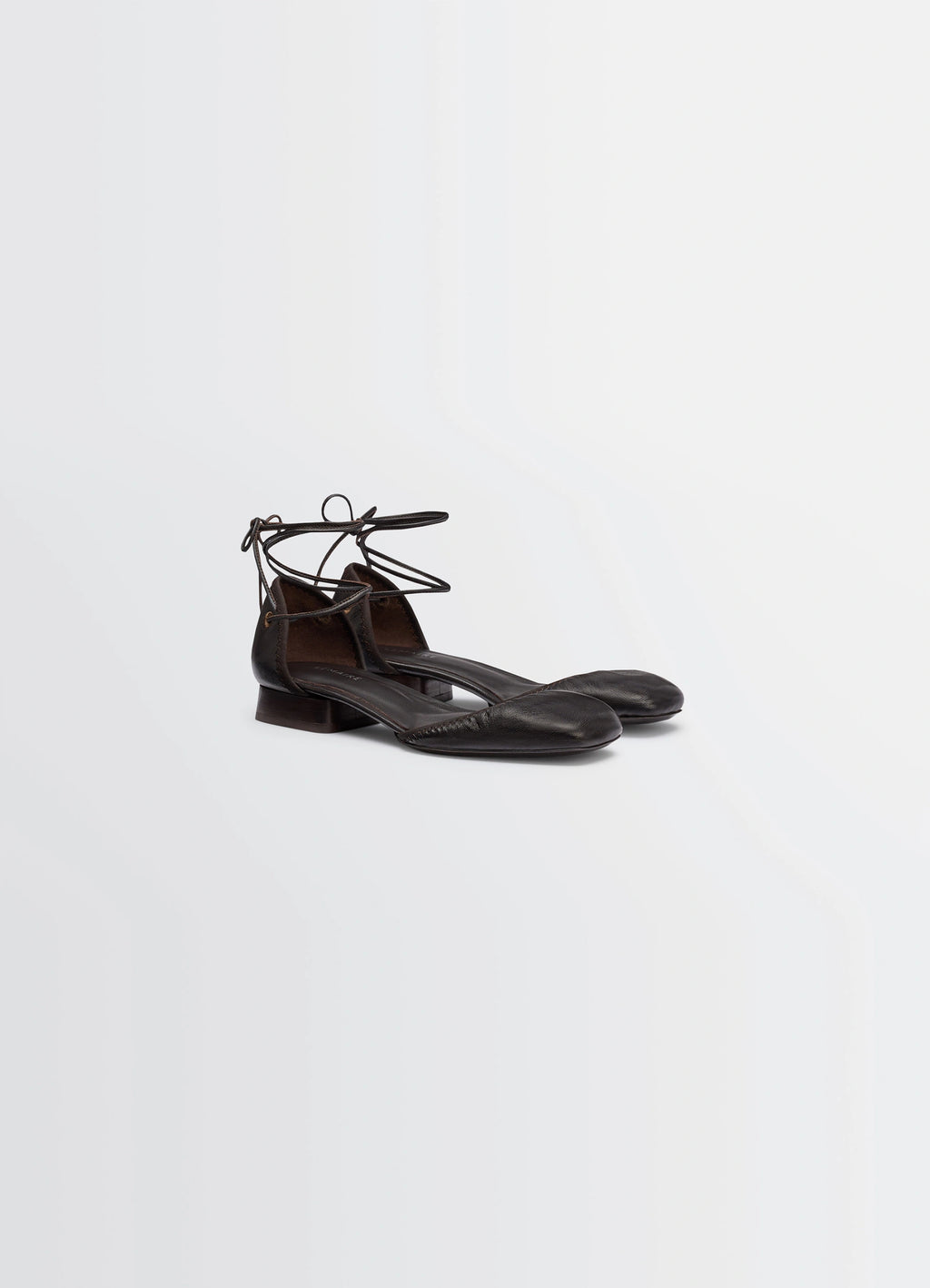 Micro Ballerina Flat in Black Supple Leather, product shot, front three-quarter view smooth round toe feature
