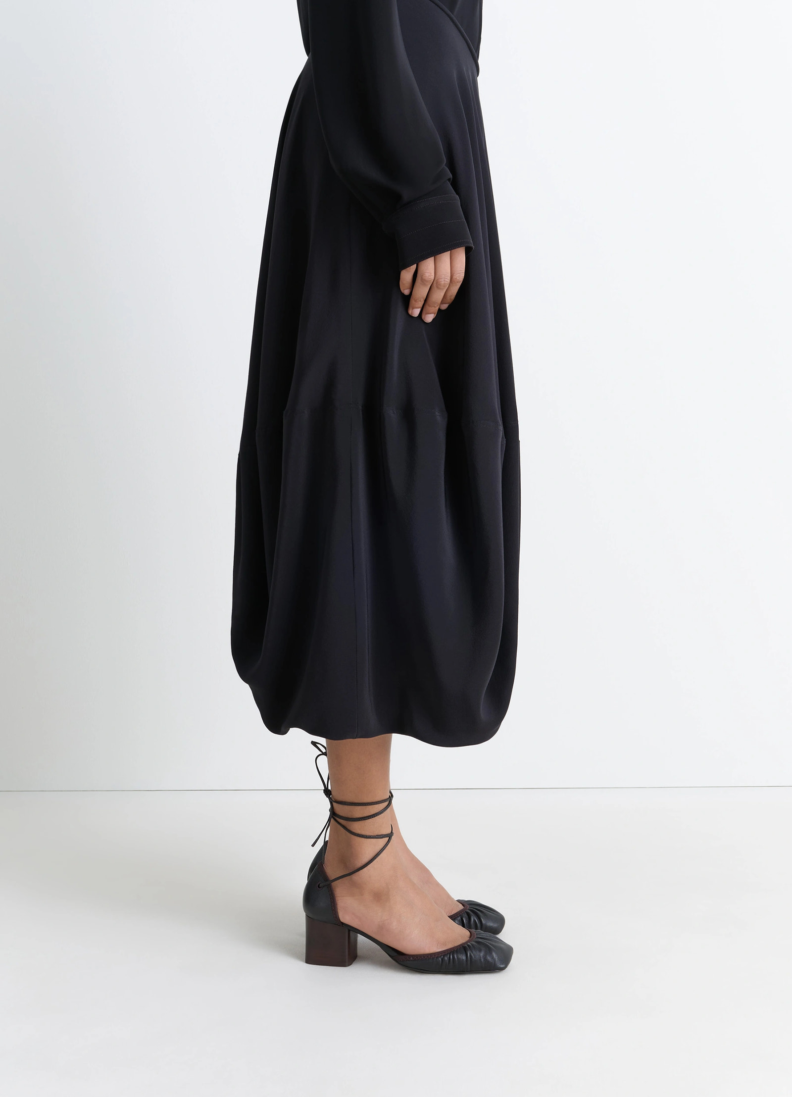 Micro ballerina 55 in black supple leather, model shot, three-quarter view square toe detail