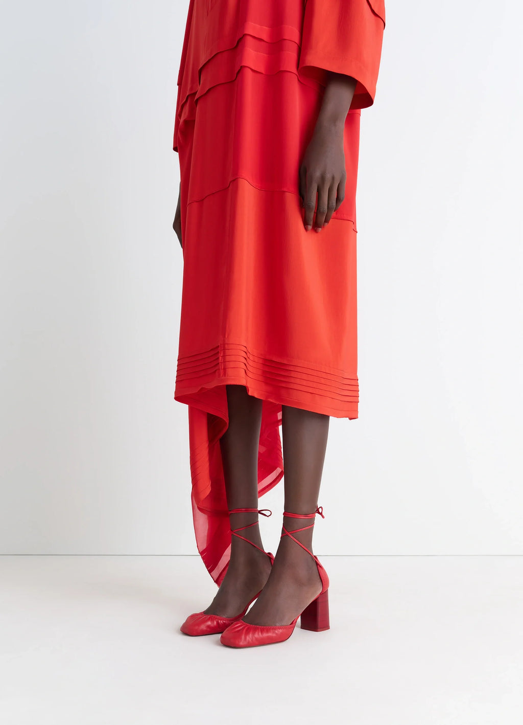 MICRO BALLERINA 85 in red supple leather, model shot, portrait view lace-up detail